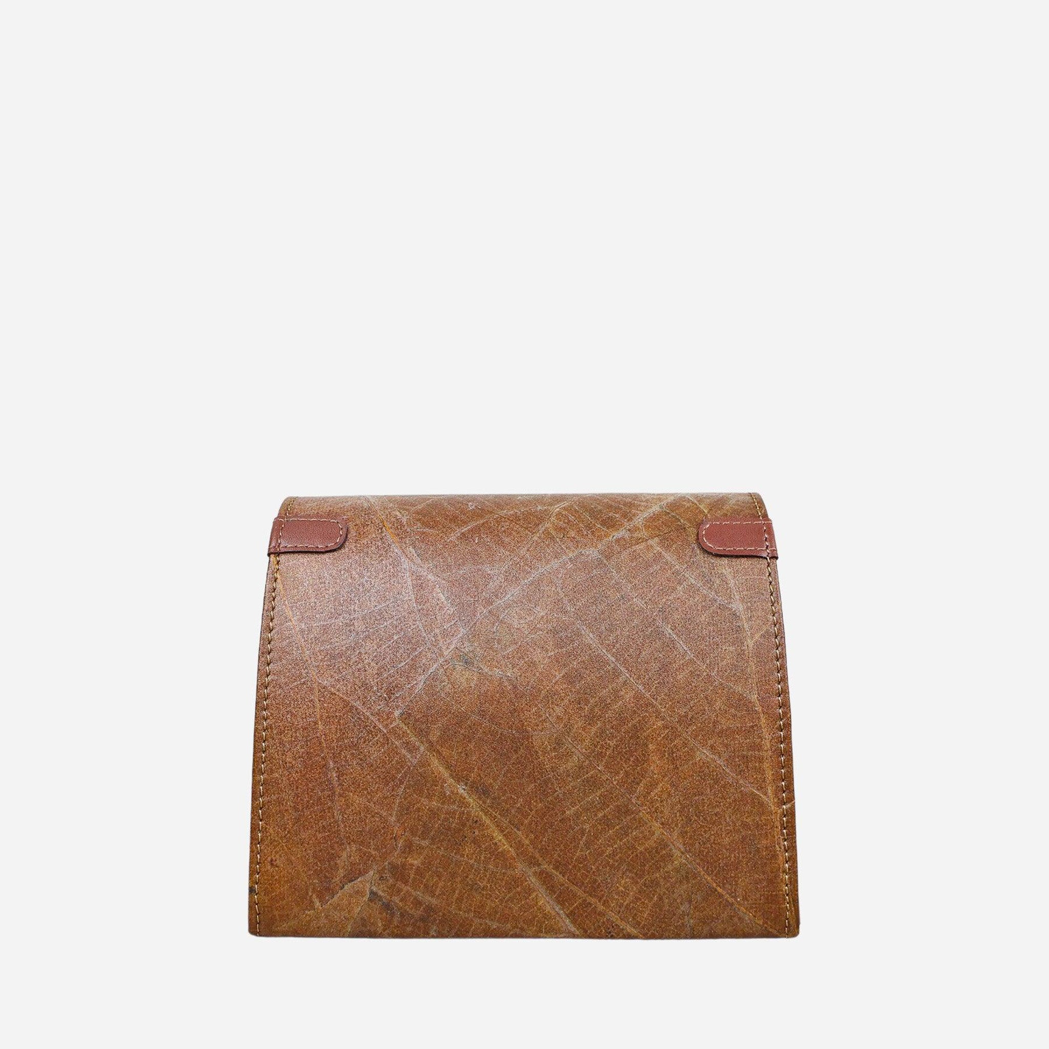 Back view of the Thamon Spice Brown Leaves Box Bag, displaying the intricate detailing of the natural leaf veins on the sustainable leaf leather and the fine craftsmanship with precise stitching along the edges.