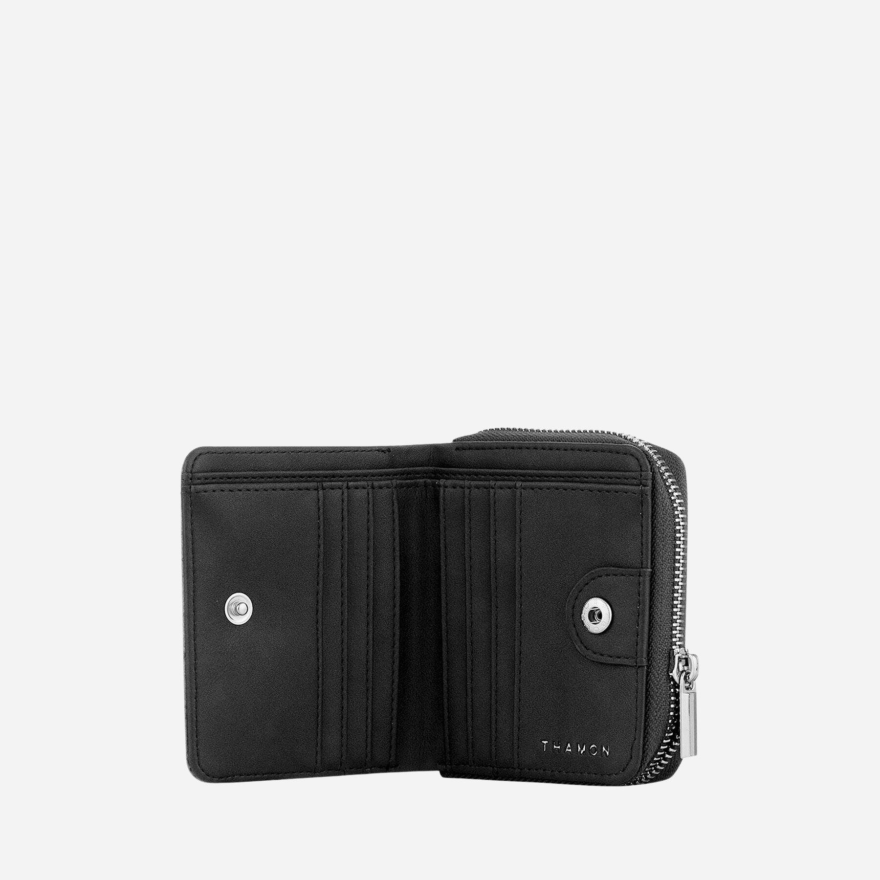 Open Thamon black leaf leather wallet showing two cash sections, multiple card slots, and embossed brand name.