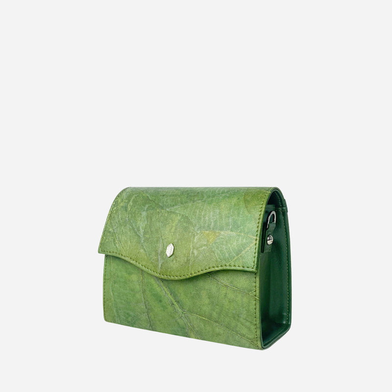 Side view of the Thamon Forest Green Leaf Leather Box Bag, featuring a vivid green leaf texture on the body, with a sleek flap closure adorned with a silver Thamon emblem, against a white backdrop.
