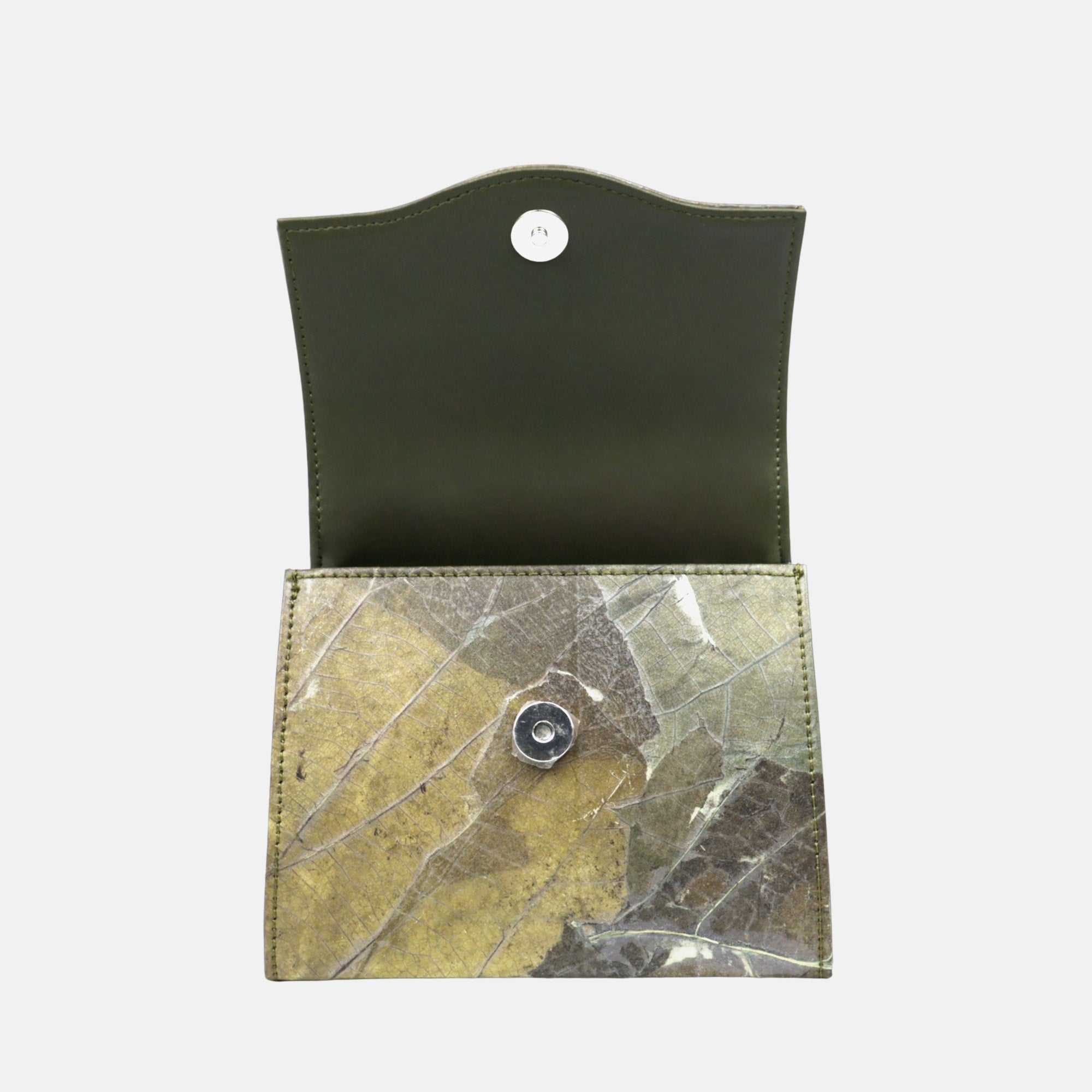 Open eco-friendly clutch wallet handcrafted from natural Leaftex, a vegan leaf leather material, featuring a unique pressed leaf pattern in earthy green and brown tones with silver magnetic snap closure and olive green interior. Sustainable fashion accessory for women and men, ideal as a stylish, cruelty-free, and meaningful gift.