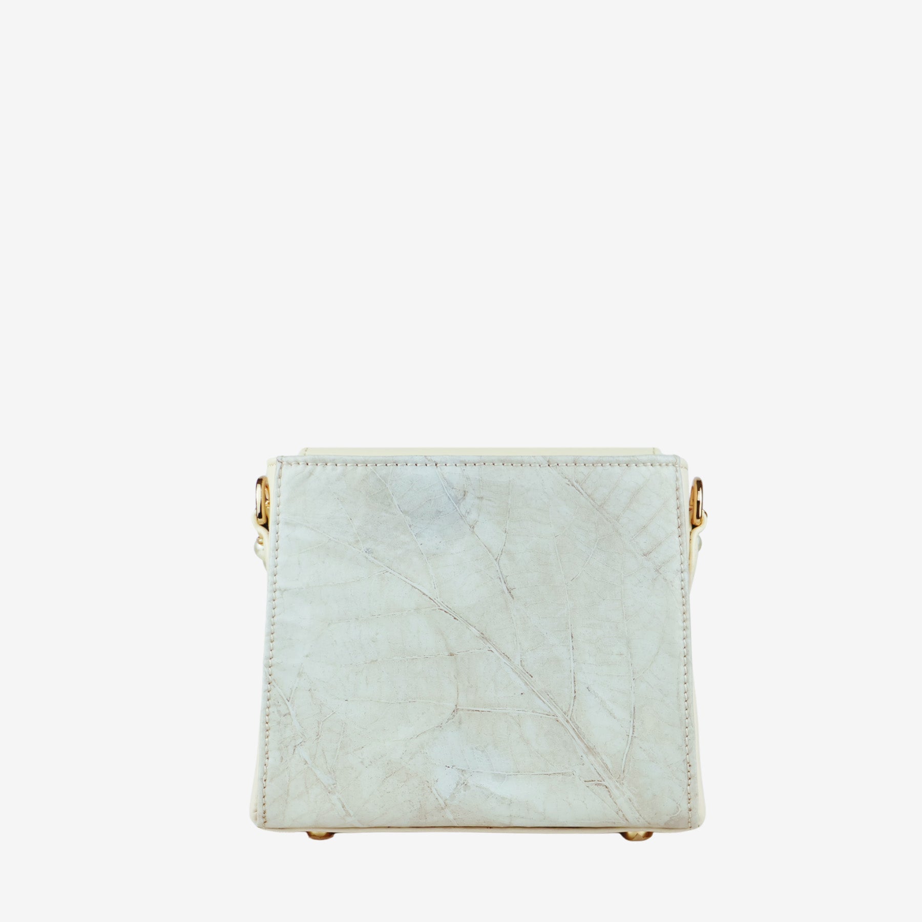 Thamon Pearl Ivory White bag, shown from the side/back, highlighting the distinct natural leaf pattern and texture of the leaf leather material.