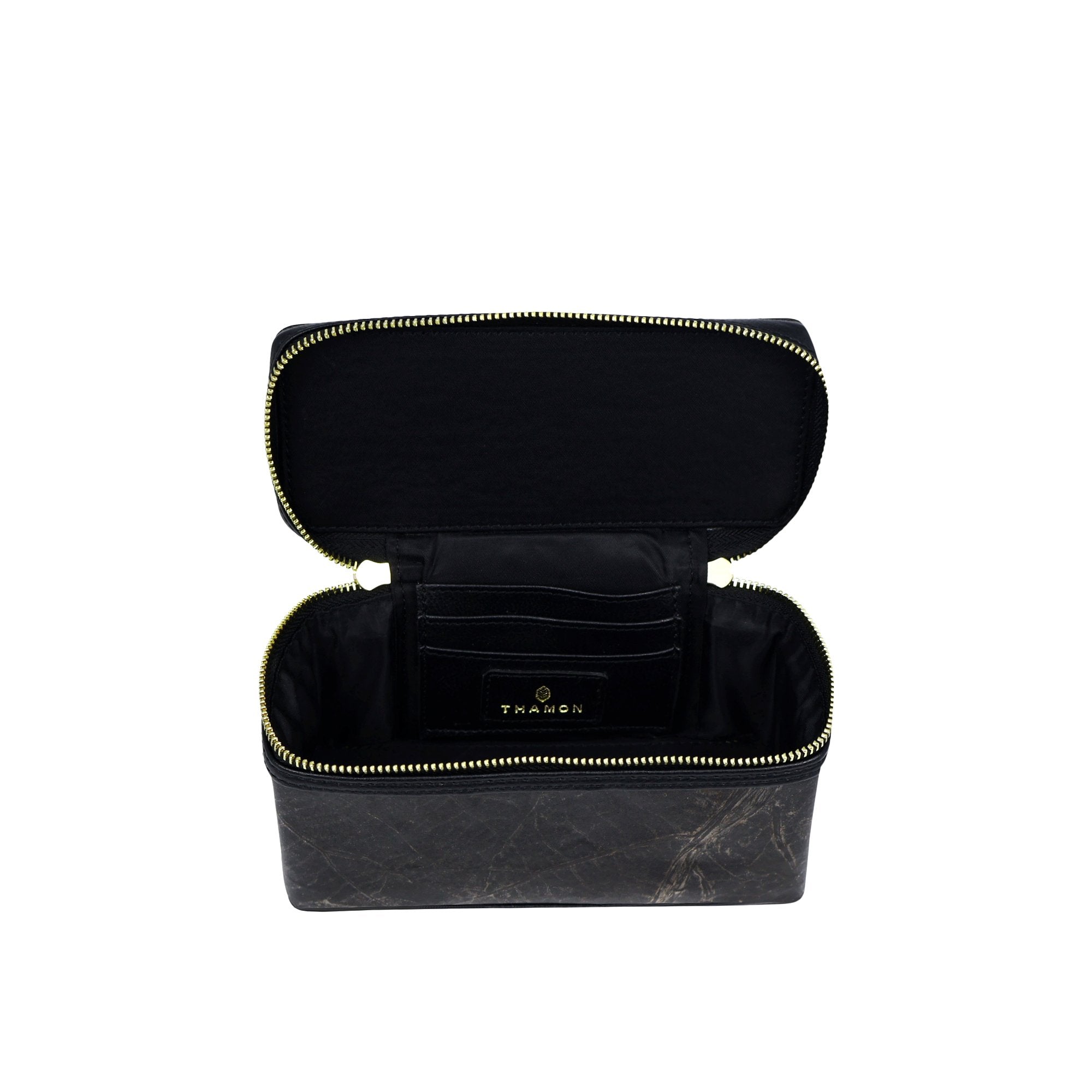 Top view of Thamon Vanity Crossbody Bag in black Leaftex with gold hardware.