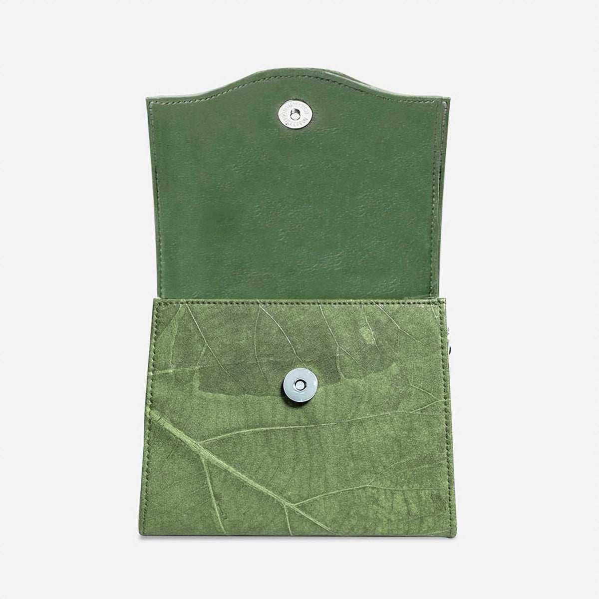 BOX crossbody bag in Olive Green shown open, revealing the magnetic closure and natural leaf texture.