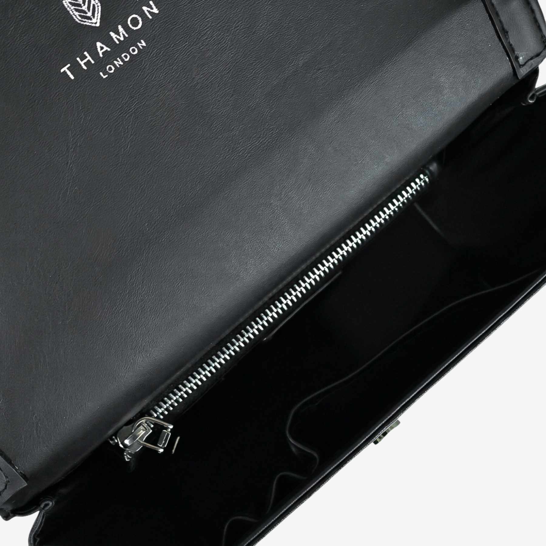 Interior detail of Camden bag in black made from leaf leather