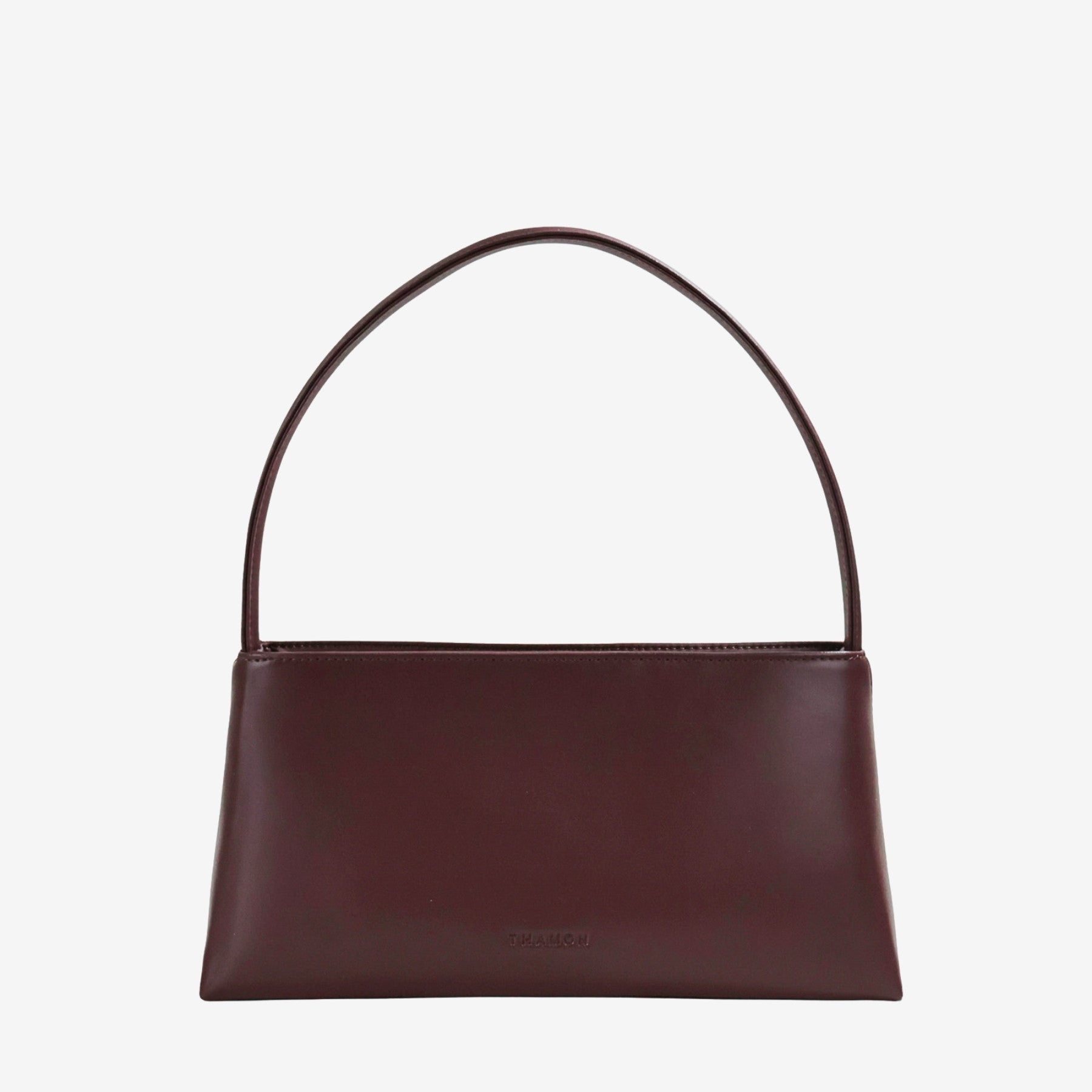 Back view of IVES bag in spice brown leaf leather showcasing high-quality handcrafted detail