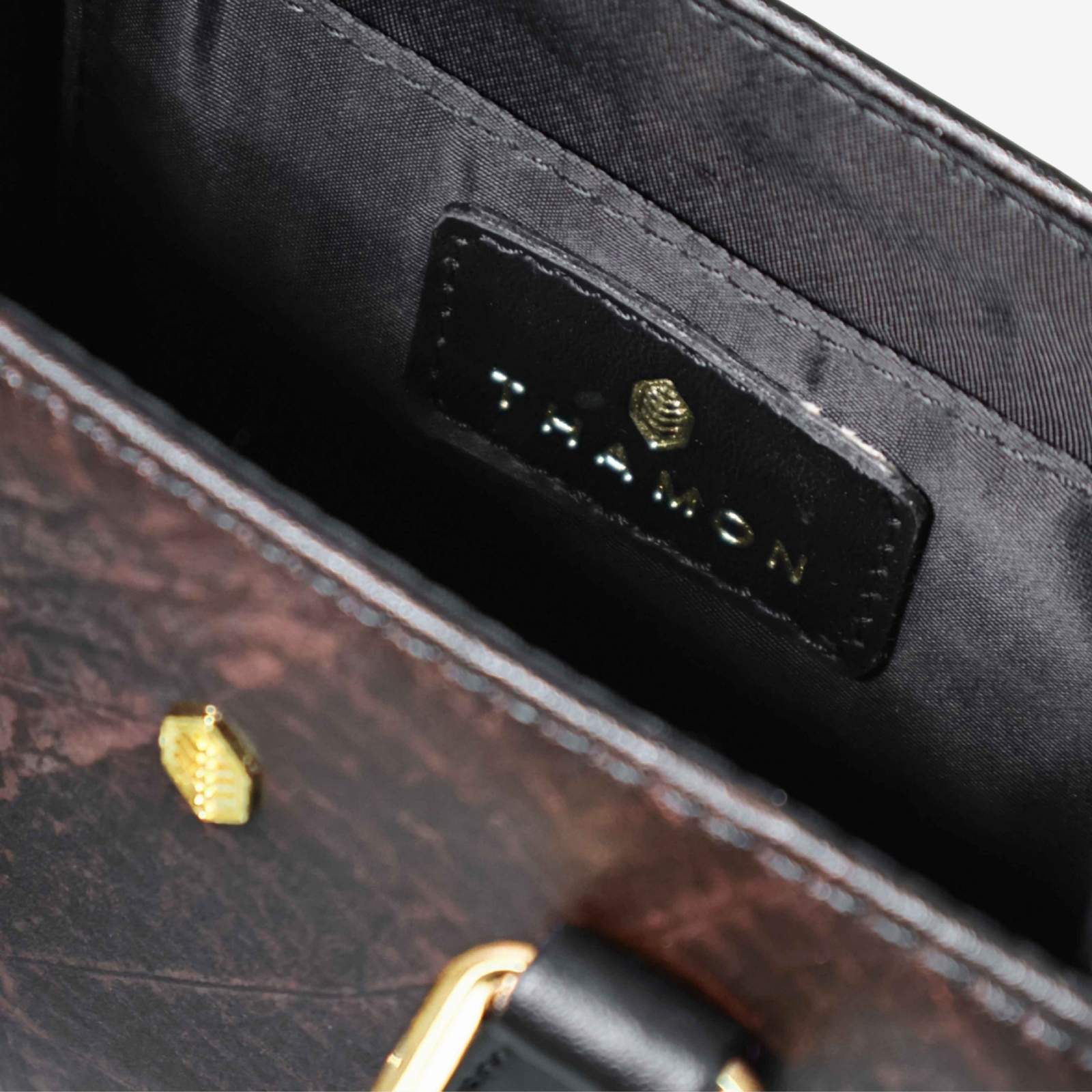 Interior view of Ivy mini crossbody bag in black made from leaf leather