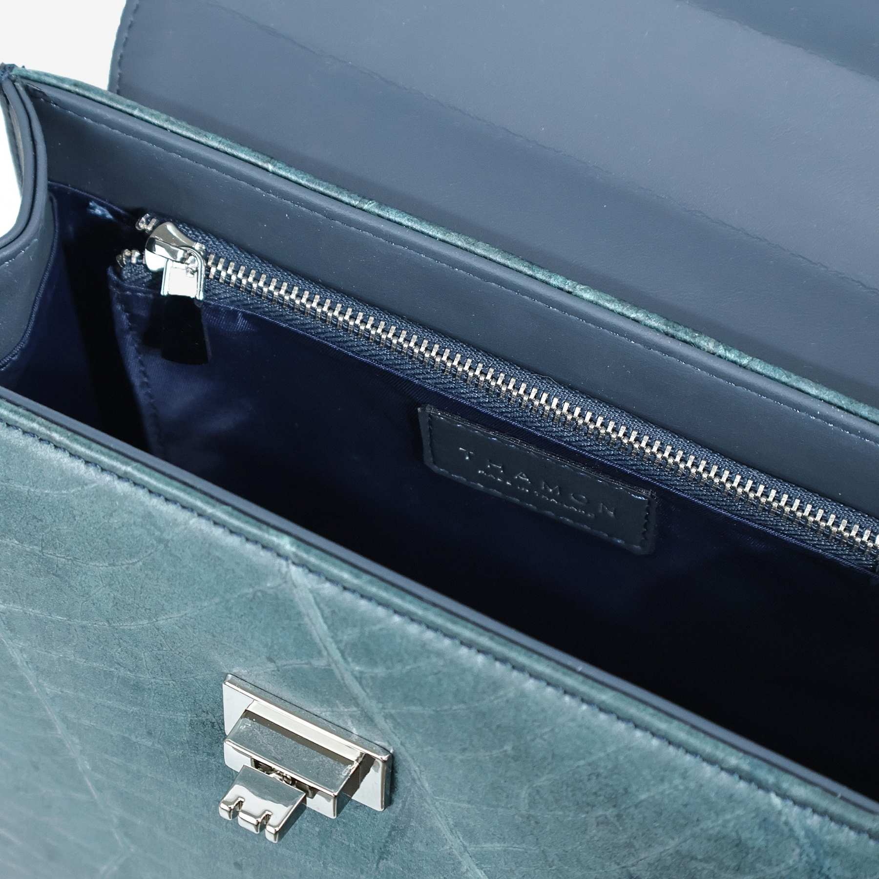 Interior of the Kylie handbag in Blue Diane Leaftex showing the zip pocket, dark lining, and silver-tone hardware.