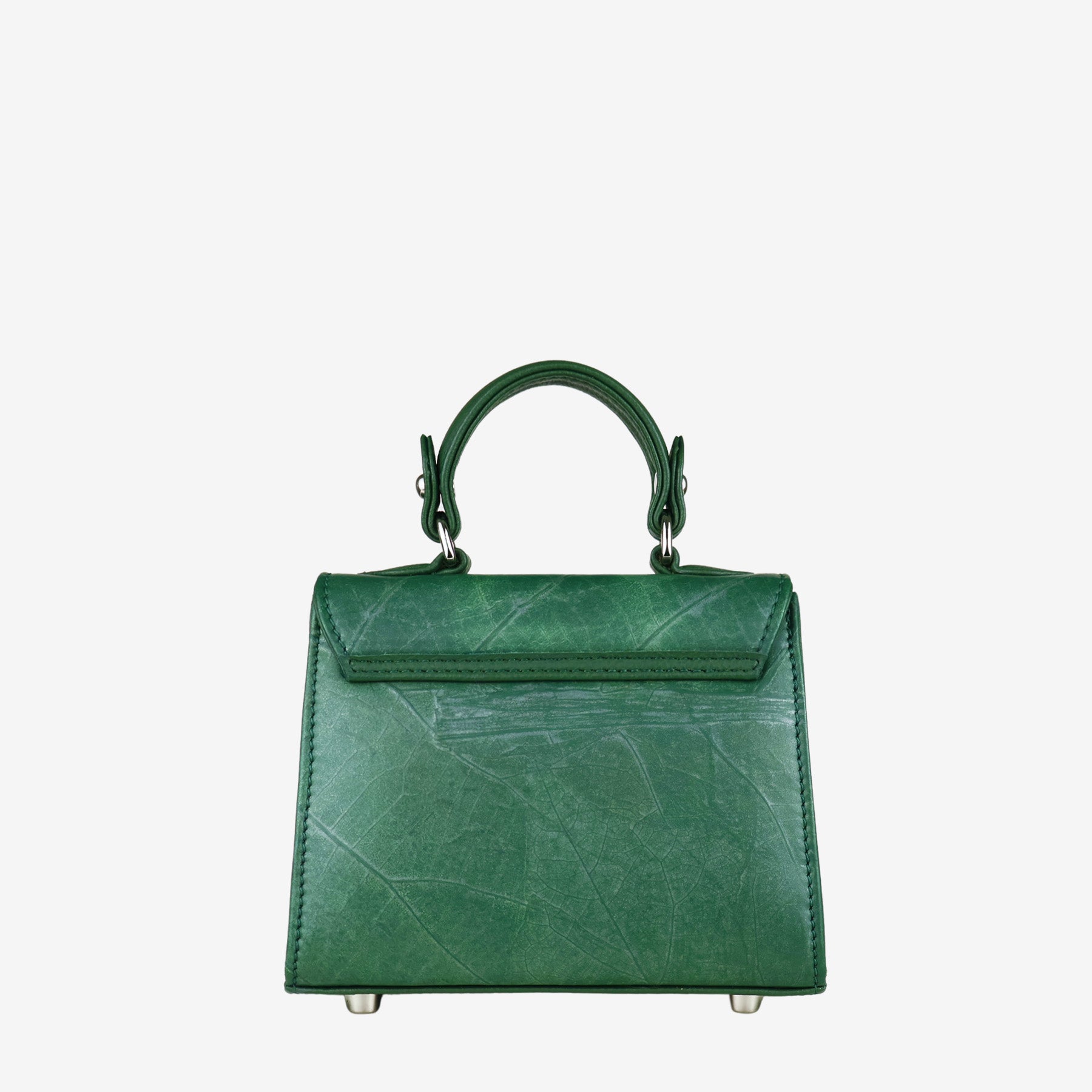 Back view of a deep green women's handbag with a subtle leaf-like texture. The bag features a single top handle connected by silver-tone hardware. The back of the bag has a smooth flap closure with stitched detailing and the same textured material on the main body. The base is equipped with four silver-tone metal feet.
