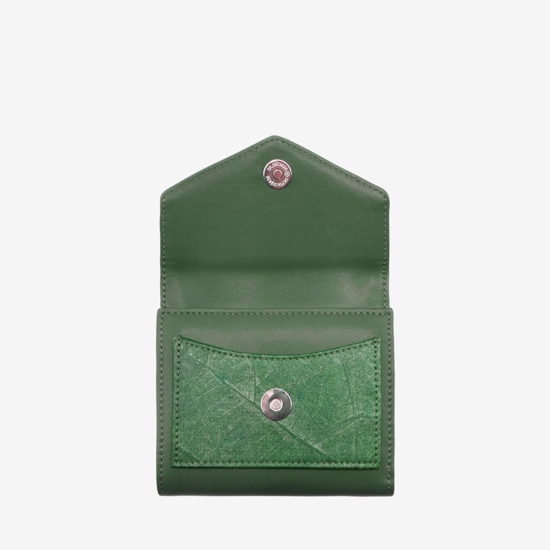 Open view of the Milly Compact Wallet in forest green leaf leather by Thamon, displaying multiple card slots and a spacious compartment