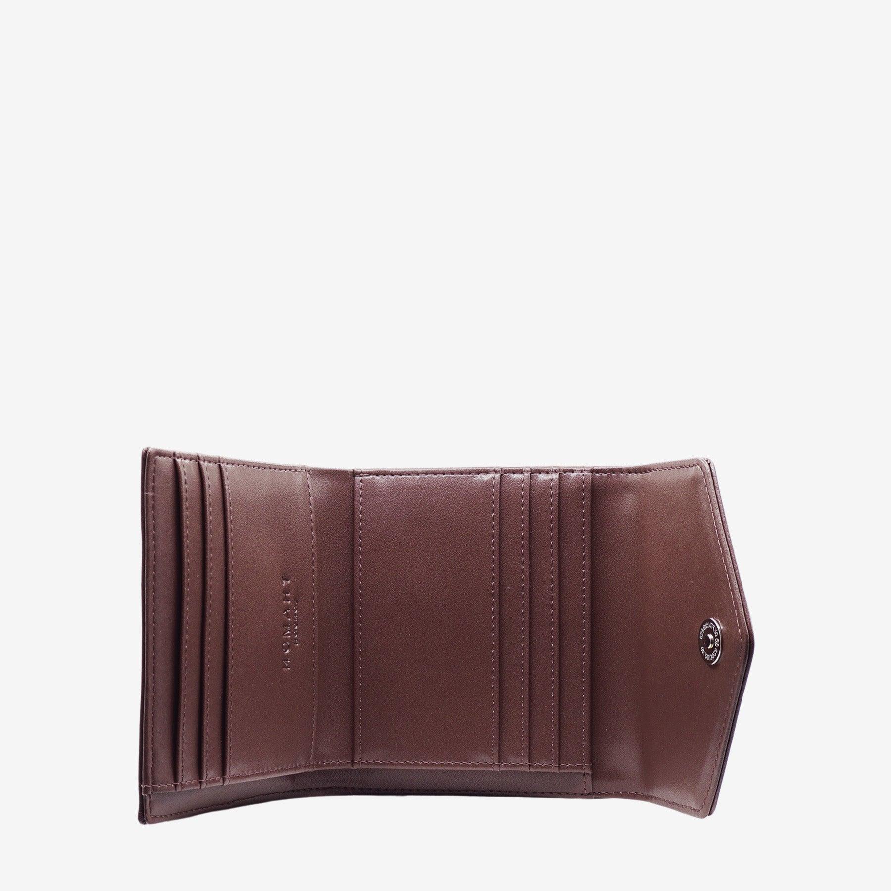 Close-up view of the inside of the Milly Compact Wallet in spice brown leaf leather by Thamon, highlighting the quality craftsmanship and Thamon logo.