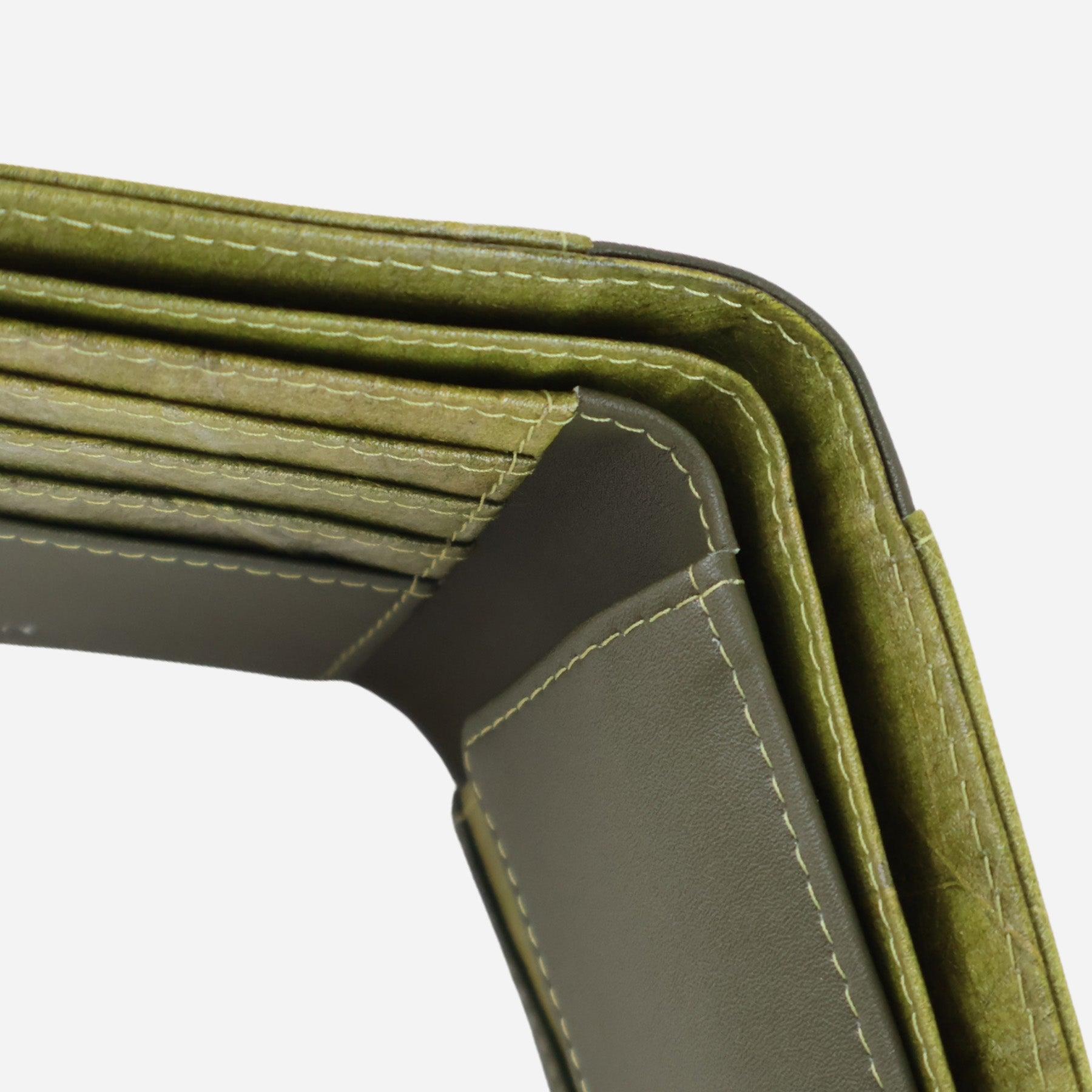 Top view of the Olive Vegan Leather Men's Coin Wallet by Thamon showcasing the stitching and material quality showcasing the cash, coin compartment and card slots.
