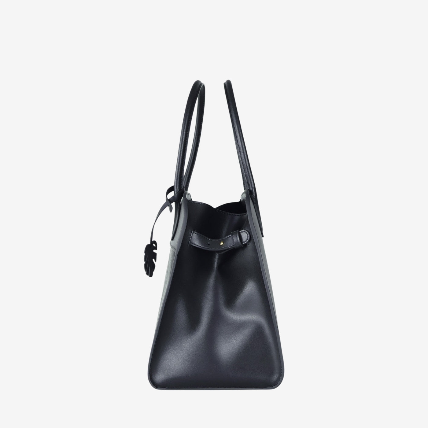 Side profile of Sloane tote bag in black made from leaf leather
