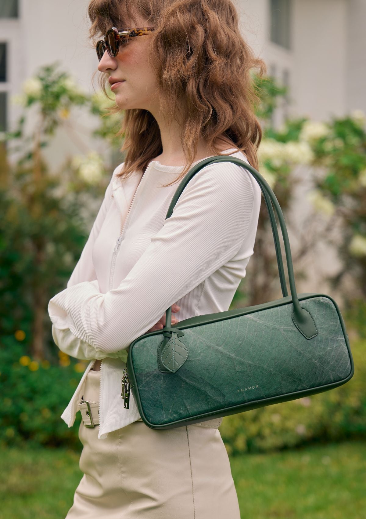 Close-up of Thamon Craugette Bag in Forest Green Leaftex, showing real leaf pattern and natural texture.