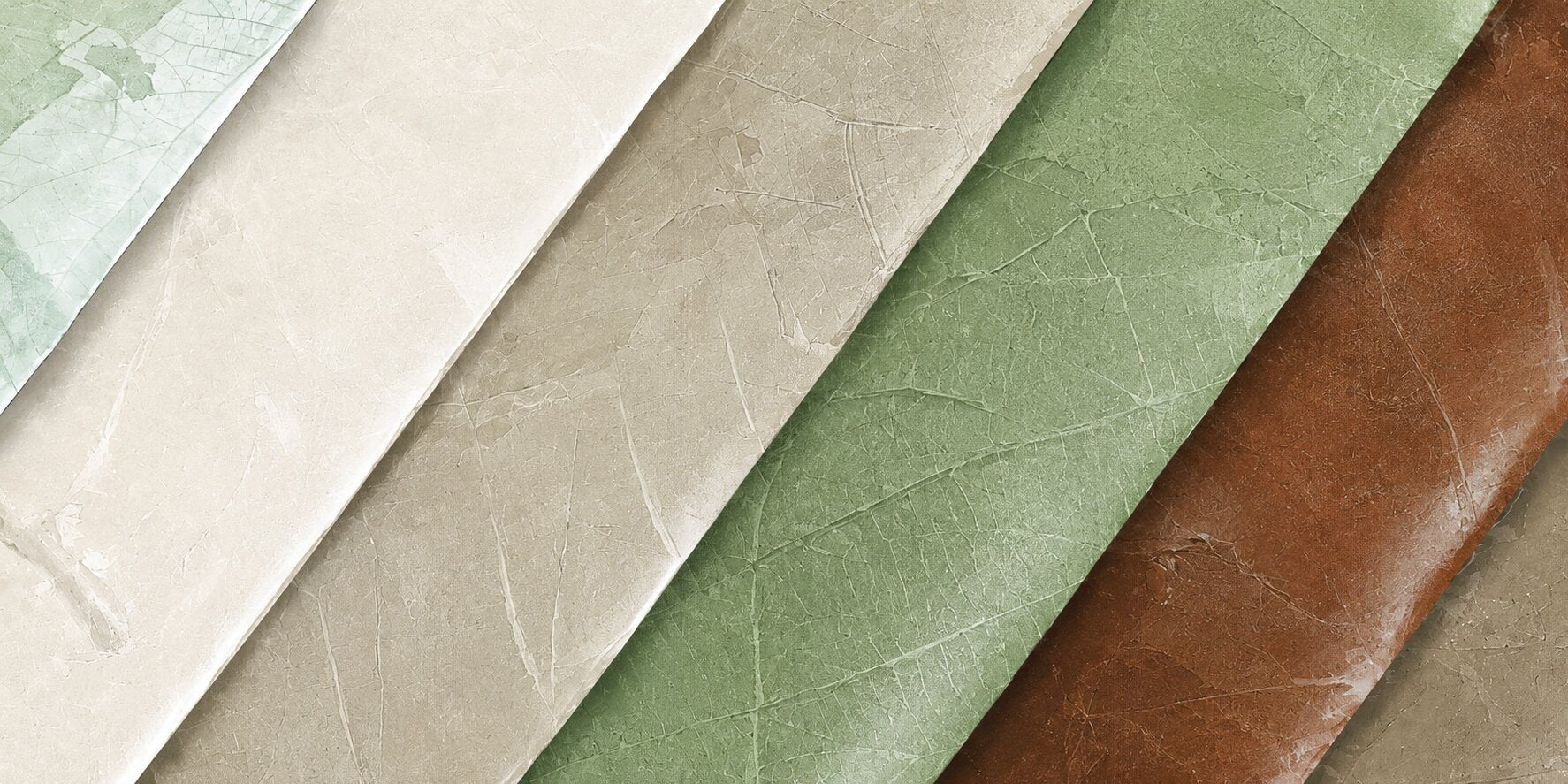Four textured Leaftex material swatches arranged diagonally in overlapping vertical strips, showing light beige, sage green, and brown surfaces with subtle embossed grain.