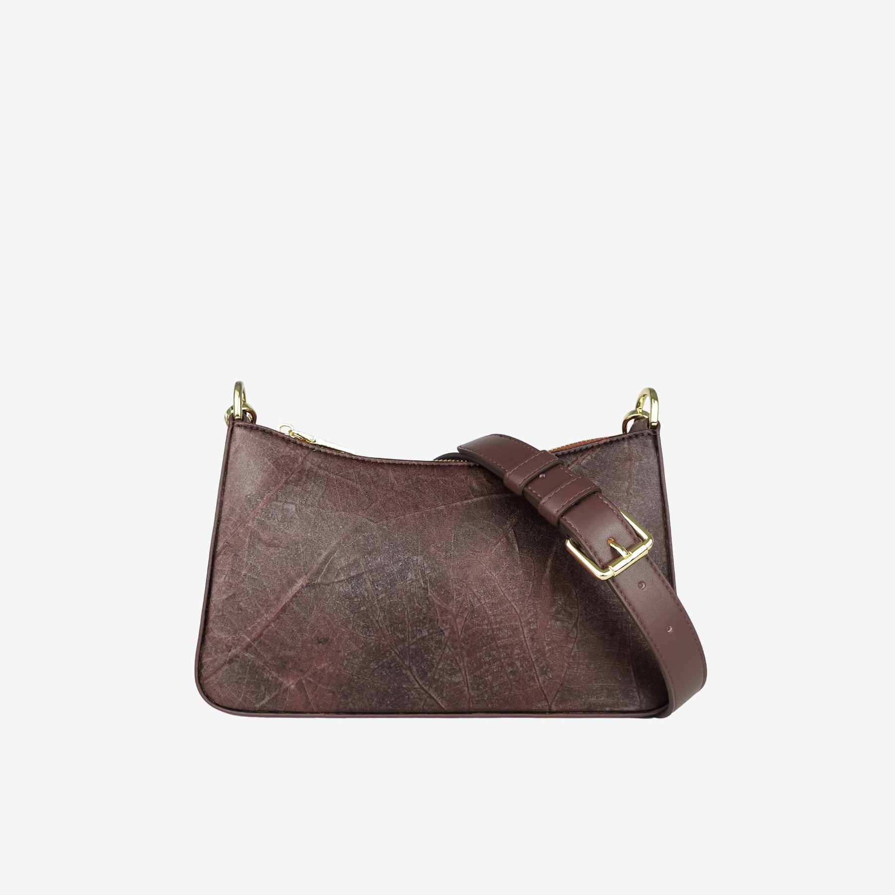 A dark walnut brown textured leaf leather Maki shoulder bag with a matching adjustable strap and gold-tone hardware, shown against a plain light gray background.
