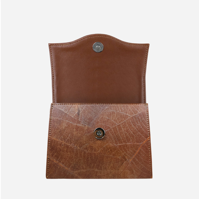Open Thamon Spice Brown Leaves Box Bag displaying its unique leaf leather texture with natural vein patterns on the flap, a smooth brown interior, and a secure snap button closure