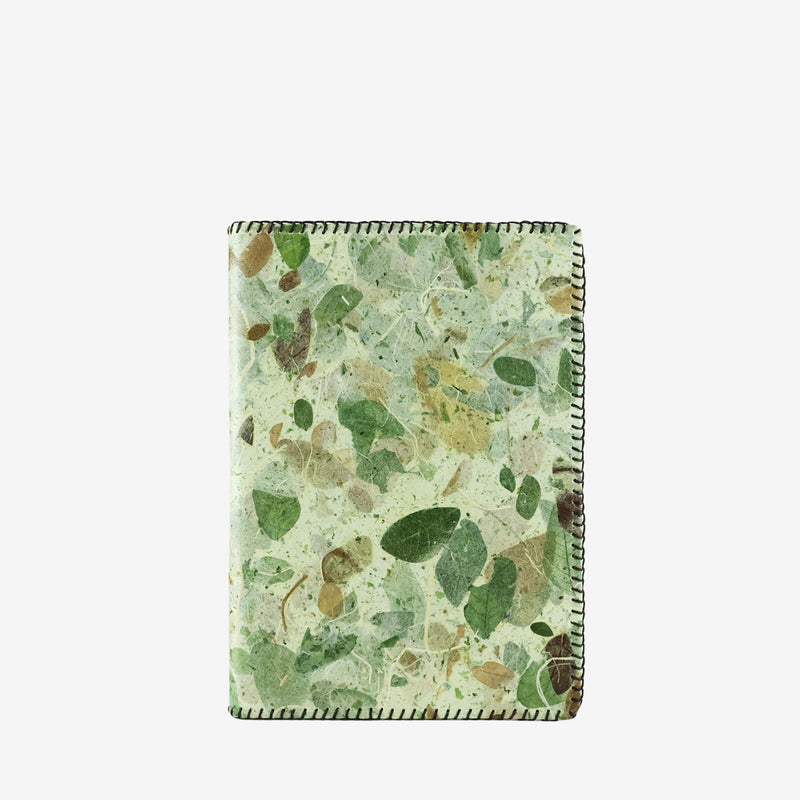 Front view of an A5 refillable notebook cover with a camouflage design, featuring shades of green and tan created from real leaves. The cover highlights a natural, textured pattern with visible leaf fragments and veins, finished with stitched edges to emphasize its eco-friendly and handcrafted style.