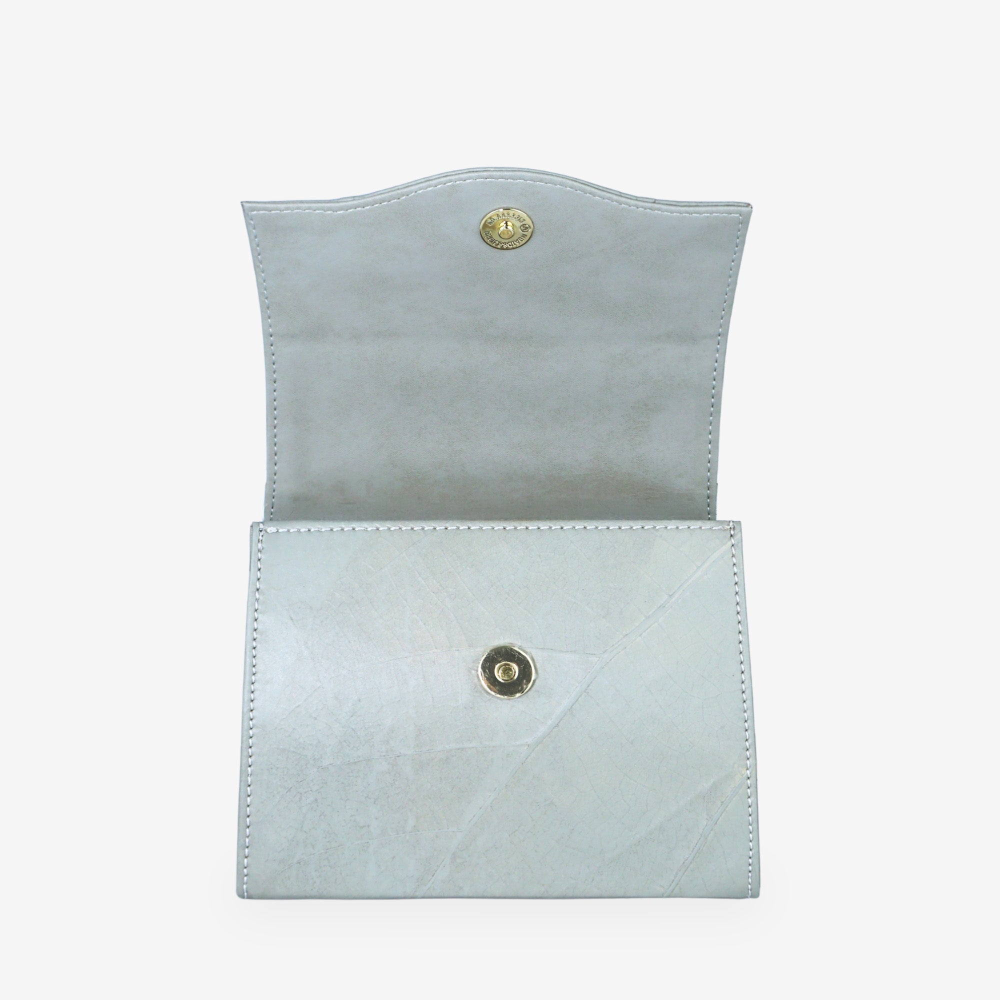 Cloud Grey Box Bag in vegan leaf leather, shown open on a white background with gold magnetic snap closures and natural leaf-vein texture.