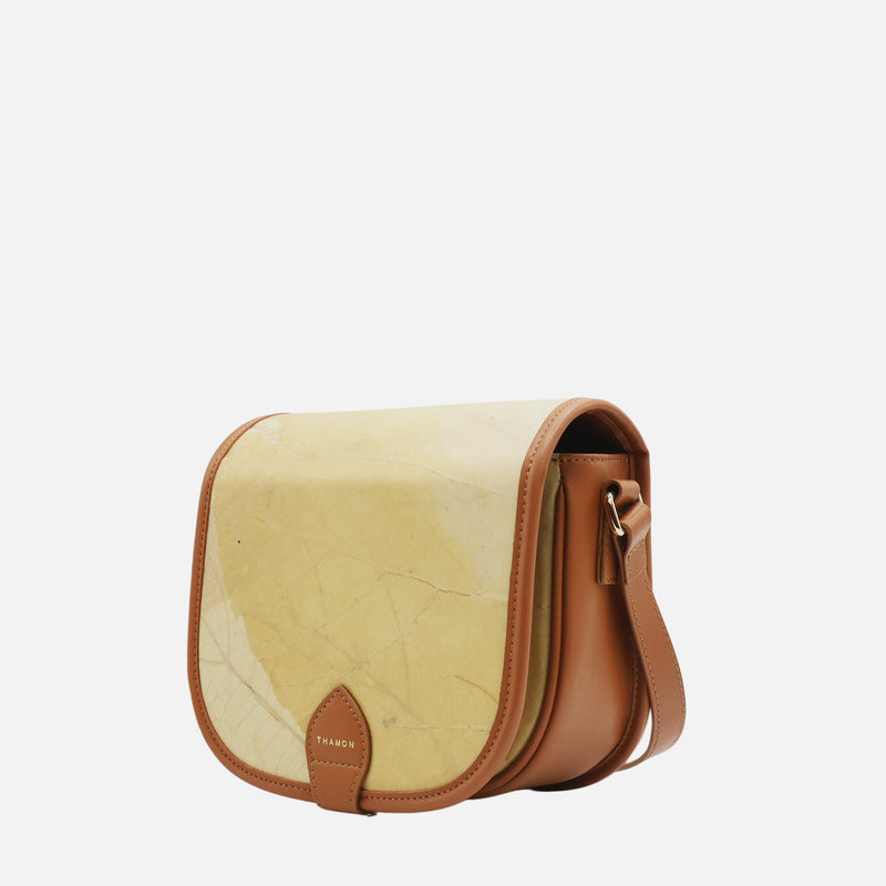 Side view of Heidi Vegan Crossbody Bag in Latte by Thamon showing the side profile and strap attachment