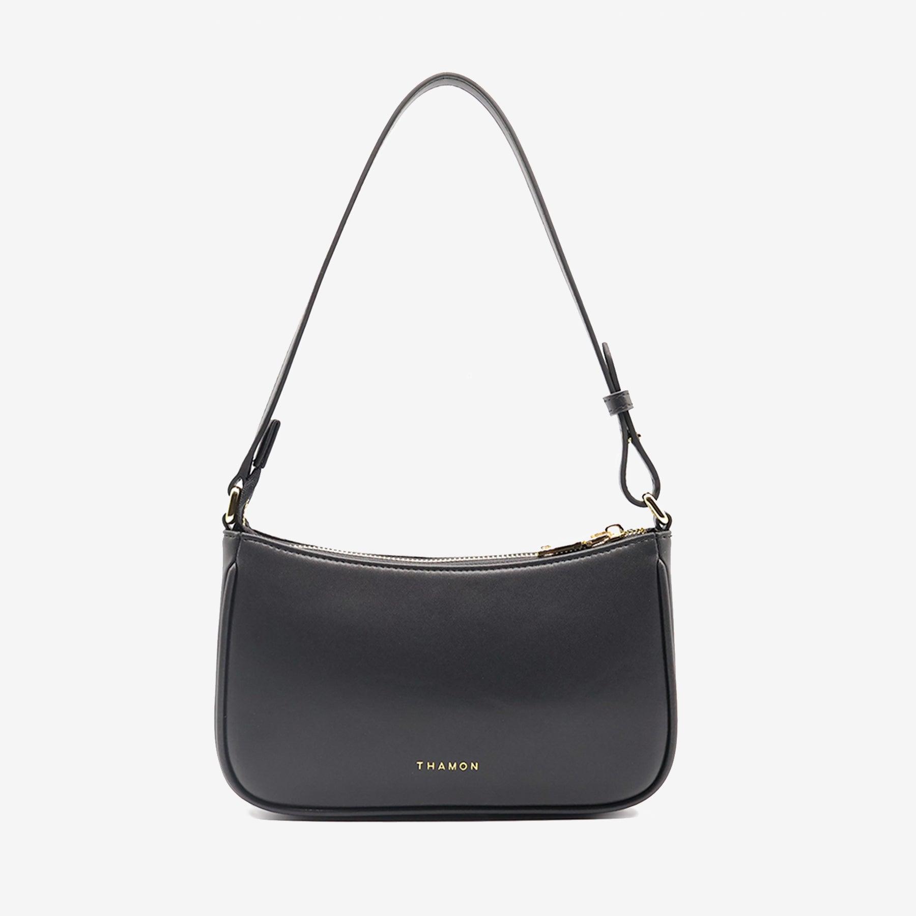 Back view of the Mila Black Vegan Shoulder Bag made from microfiber leather with a smooth finish featuring Thamon branding and sleek design