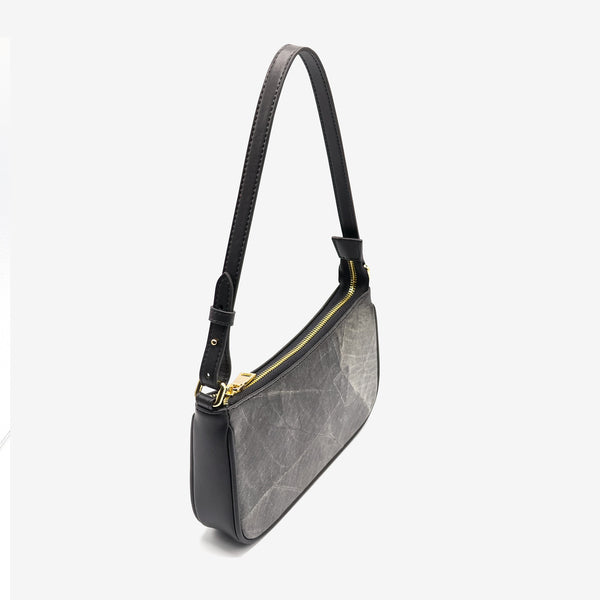 Side view of the Mila Black Vegan Shoulder Bag showcasing the zipper closure and elegant microfiber leather.
