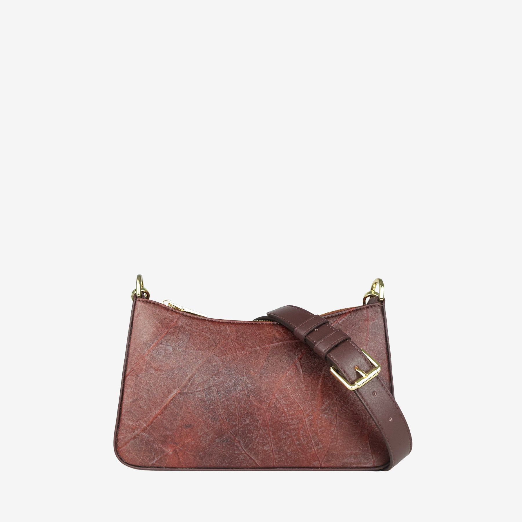 Spice brown Maki bag with adjustable strap, shown from the side with gold hardware