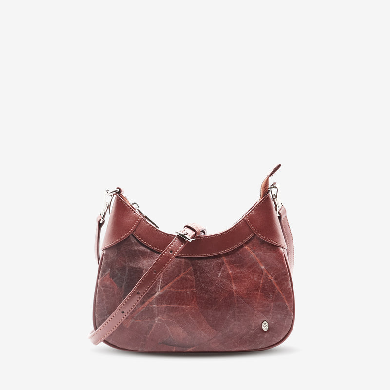 Front view of Kara Vegan Shoulder Bag in Chestnut Brown by Thamon with detachable crossbody strap showcasing its unique leaf pattern and sleek design.