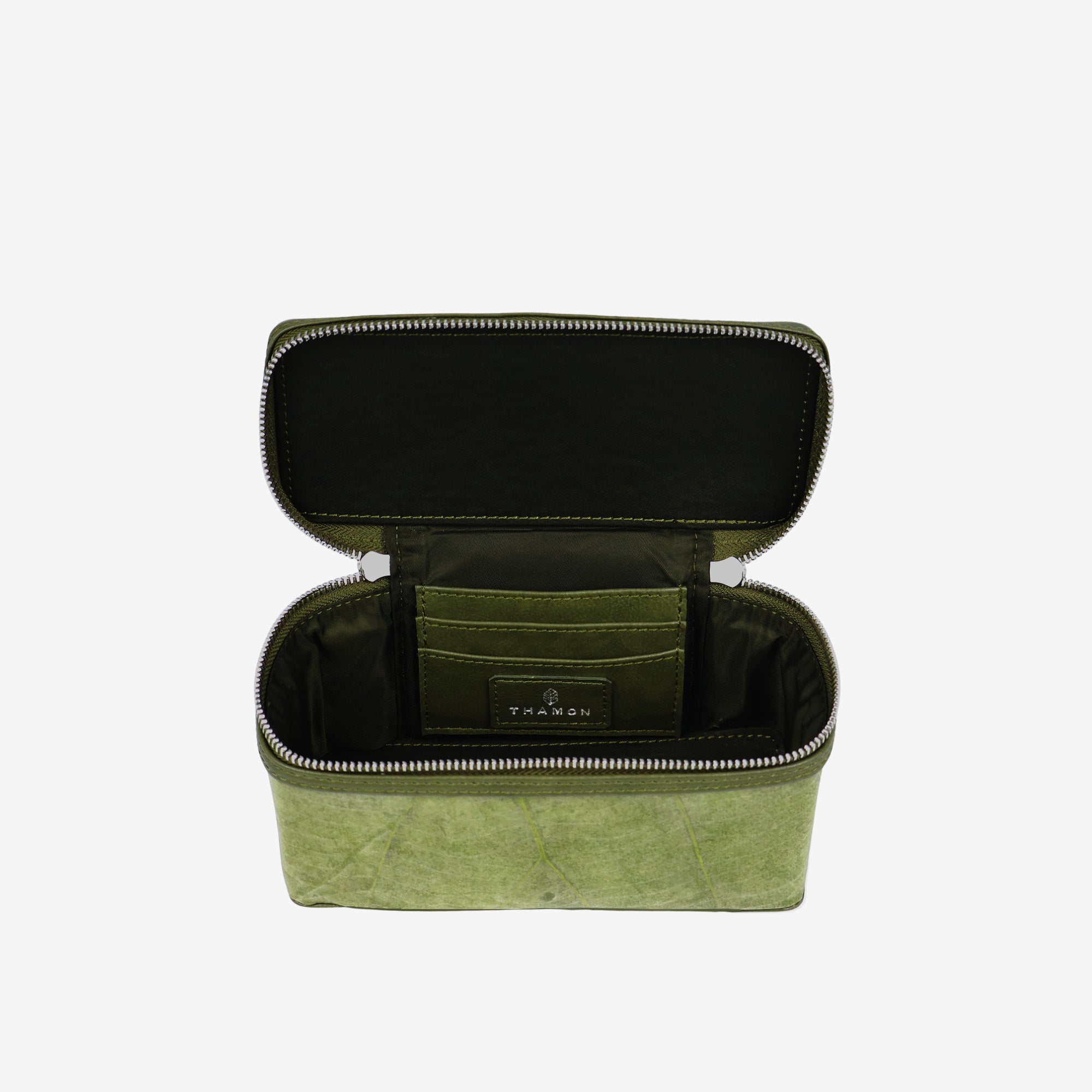 Top view of Thamon Vanity Crossbody Bag in olive green Leaftex with silver hardware.