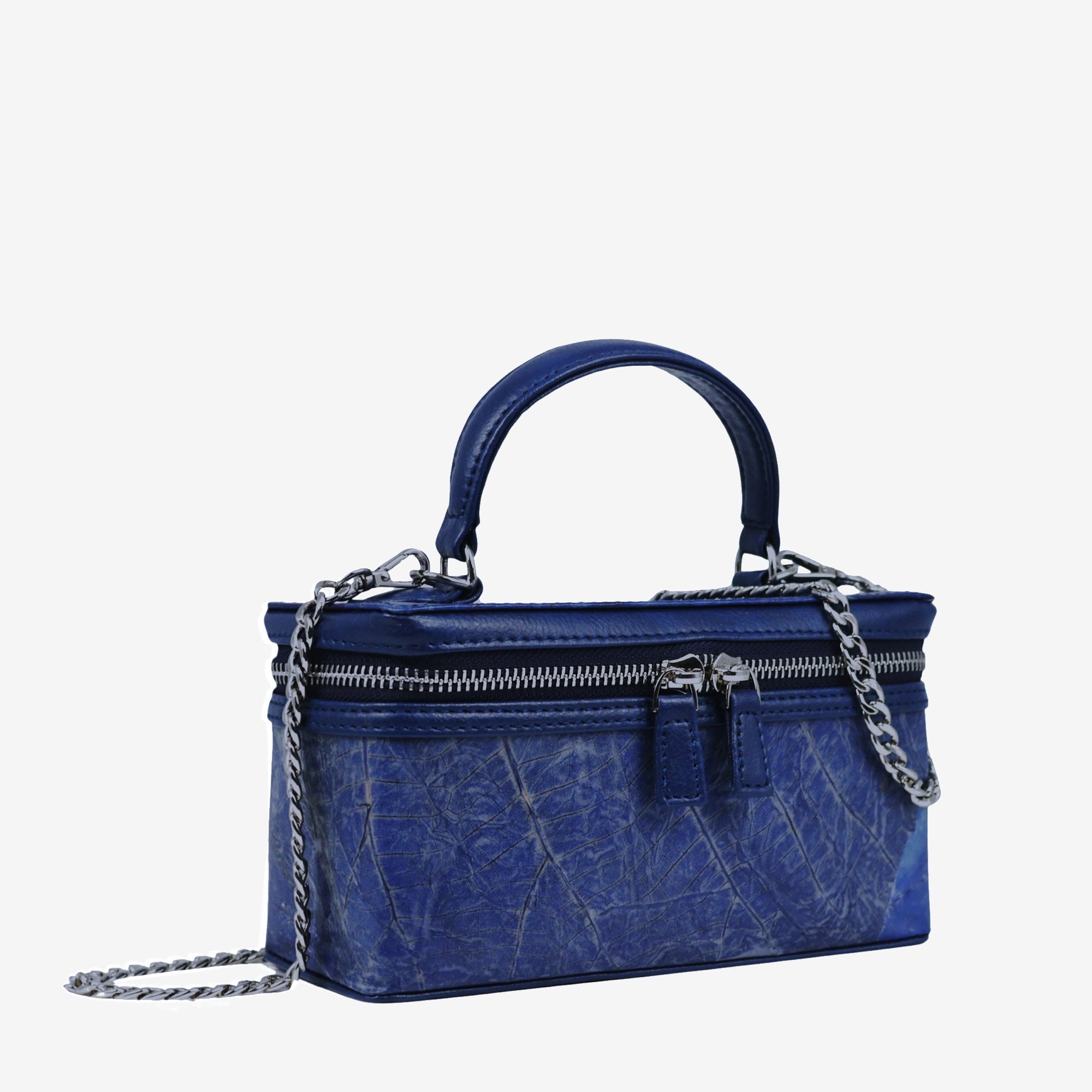 Side view of Thamon Vanity Crossbody Bag in sapphire Leaftex with silver hardware.