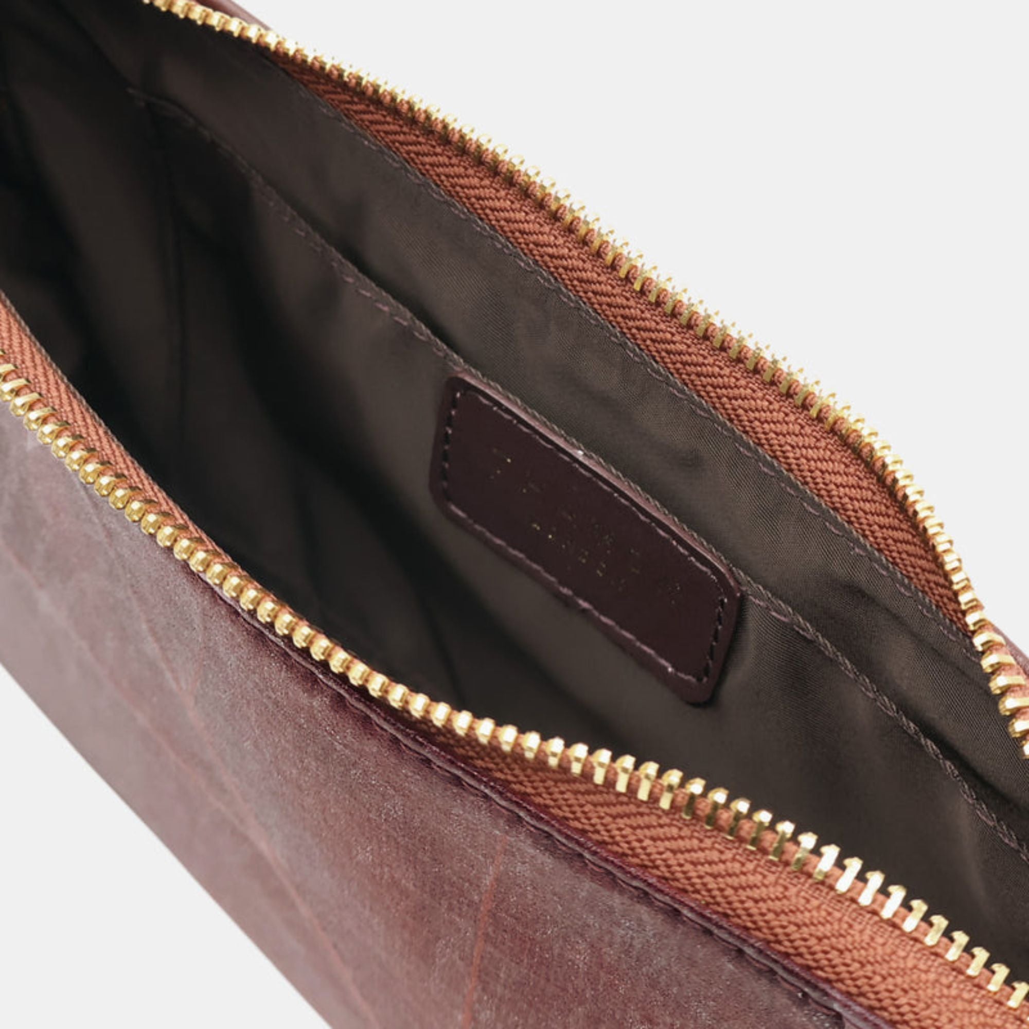 Inside view of the Mila Walnut Brown Vegan Shoulder Bag with leaf leather detailing and adjustable shoulder strap