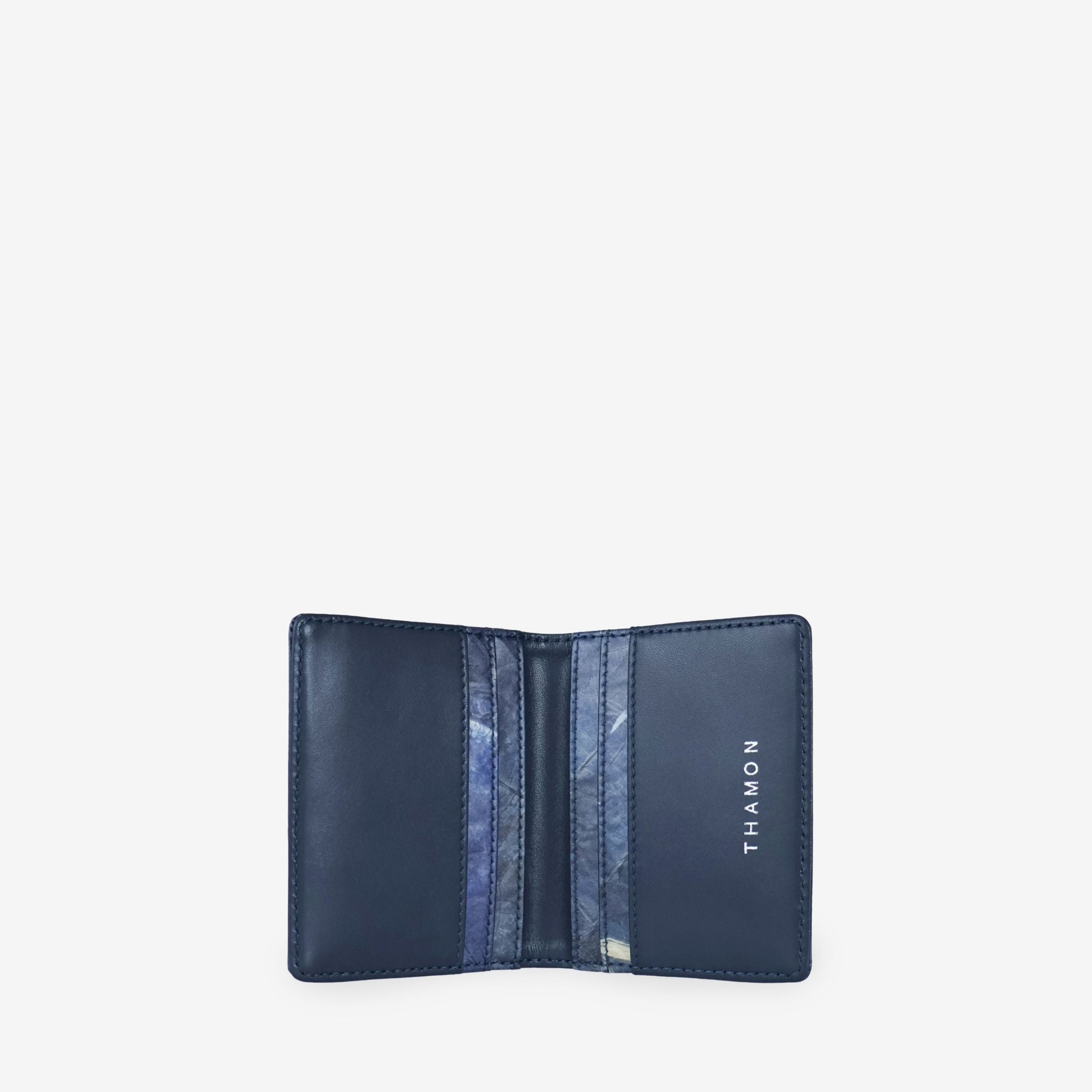 THAMON Bifold Cardholder in Sapphire made with real-leaf Leaftex and vegan microfiber, shown open with interior card slots.