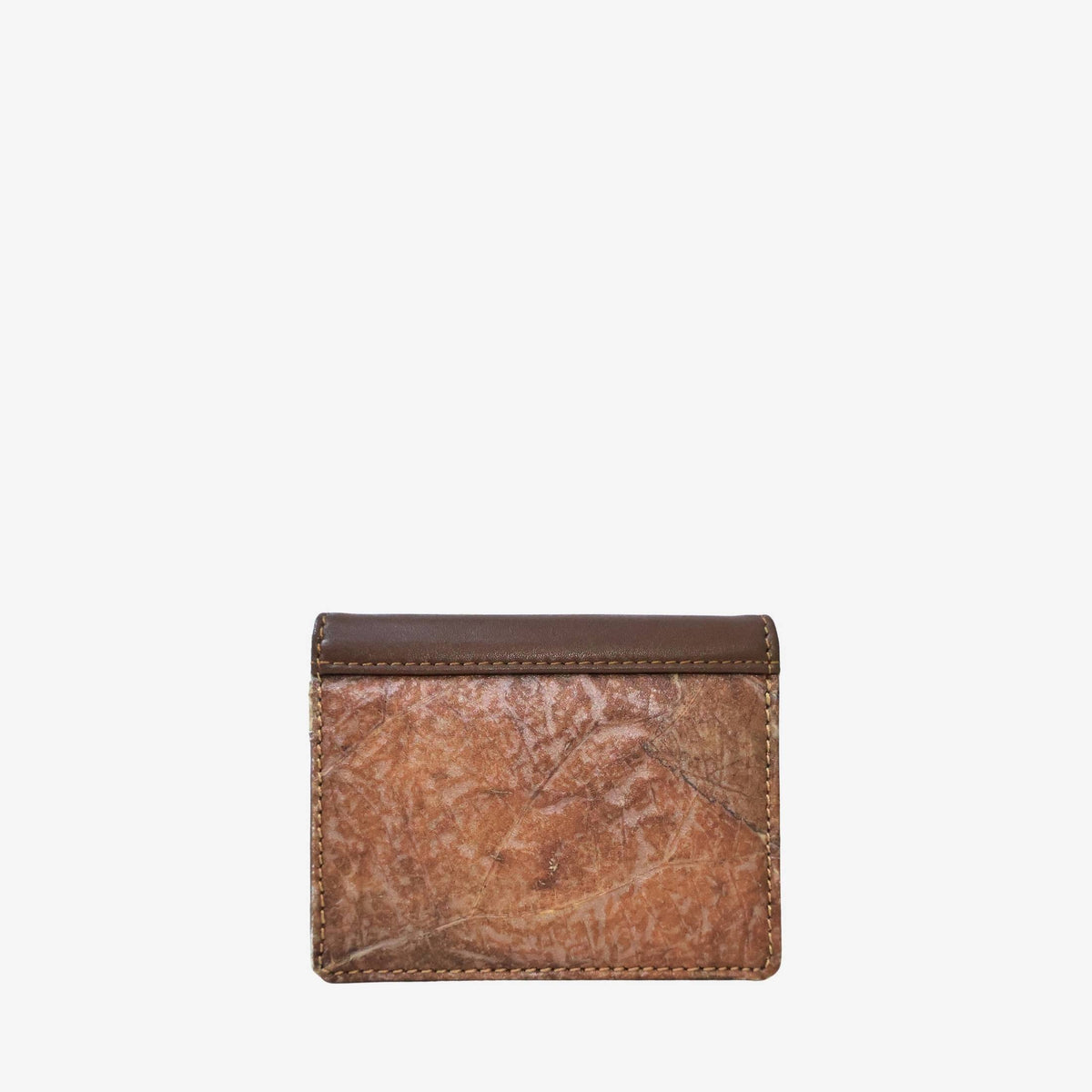 Back view of the Bifold cardholder in Spice Brown, showing the natural Leaftex leaf pattern and stitched edges.