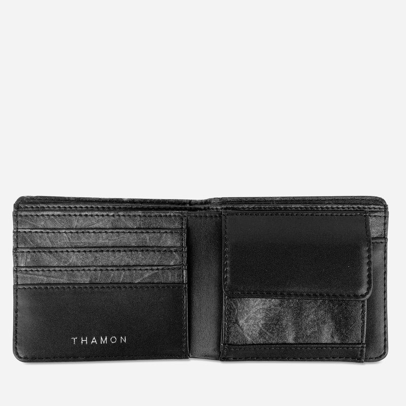 Detailed inside view of the Black Vegan Leather Men's Coin Wallet by Thamon with the coin compartment open.