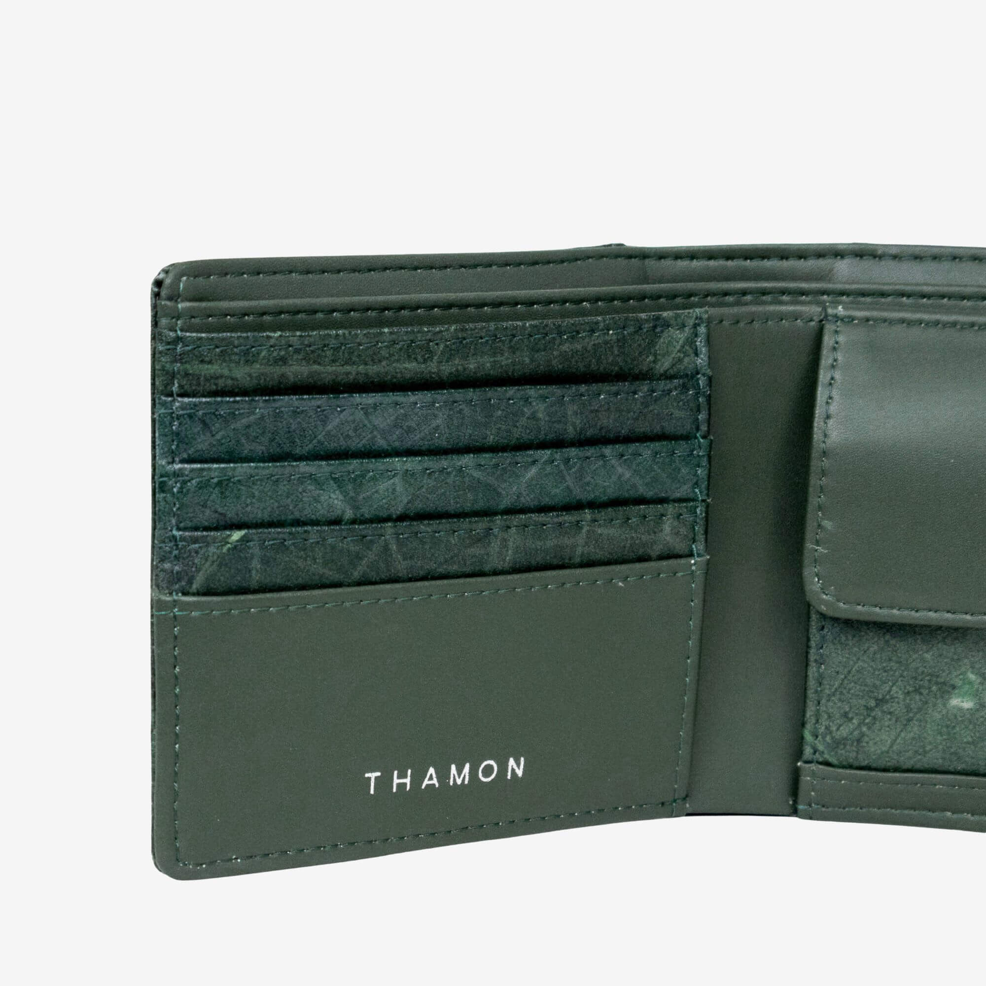 Close up leaf texture of coin wallet in forest green made from leaf leather
