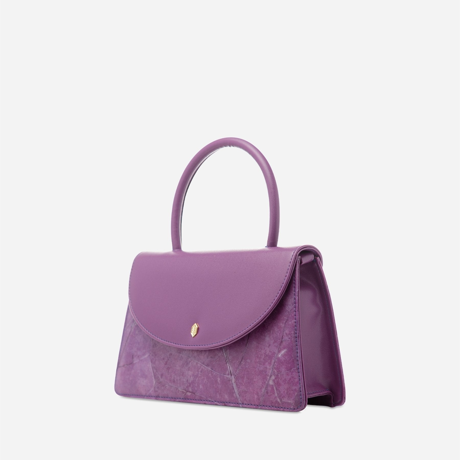 Angle view of Ellie handle bag in lavender made from leaf leather