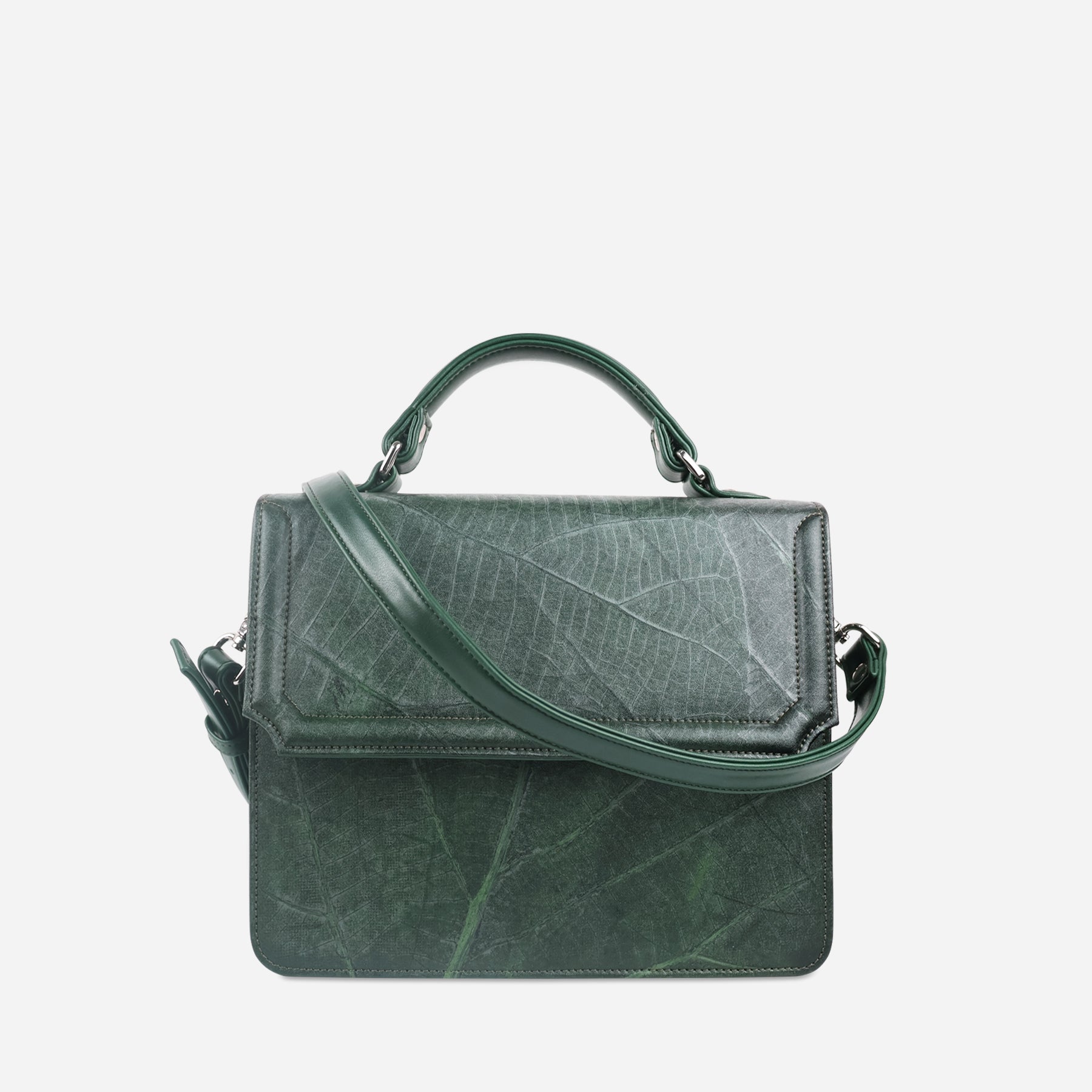 Camden crossbody bag in forest green Leaftex with adjustable strap draped across the front and top handle detail