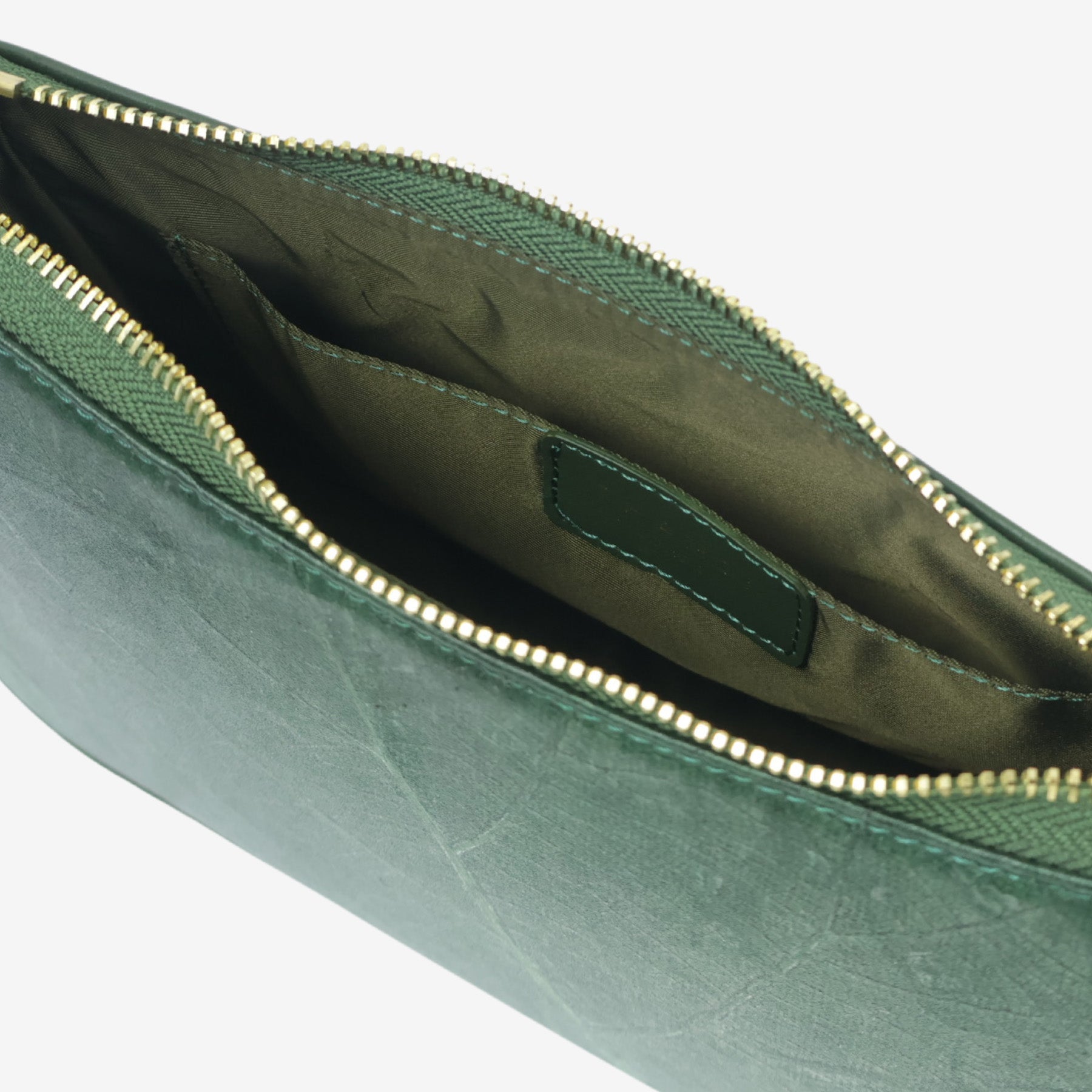 Inside view of Forest Green Maki Bag, lined with eco-friendly fabric and showing the internal pocket