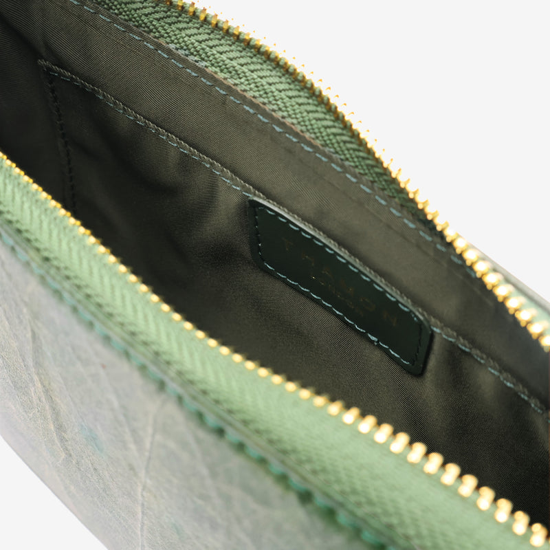 Inside view of the Mila Forest Green Vegan Shoulder Bag showing the internal pocket with Thamon logo and zippered closure.