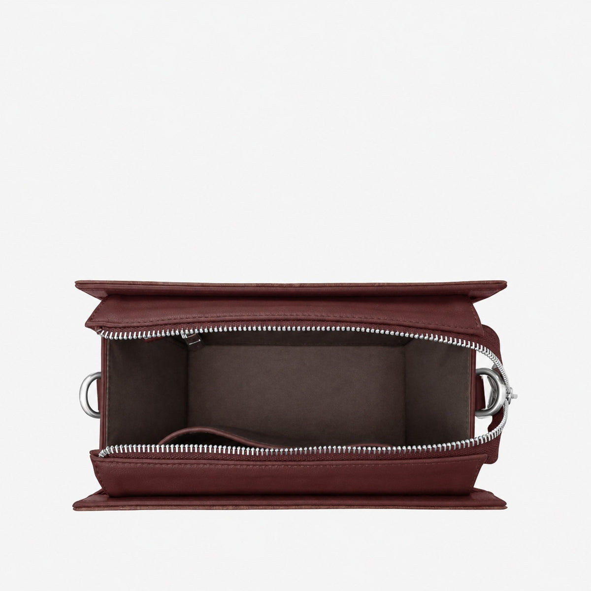 Open Ingrid bag in Walnut Brown showing the interior compartment and silver zip hardware