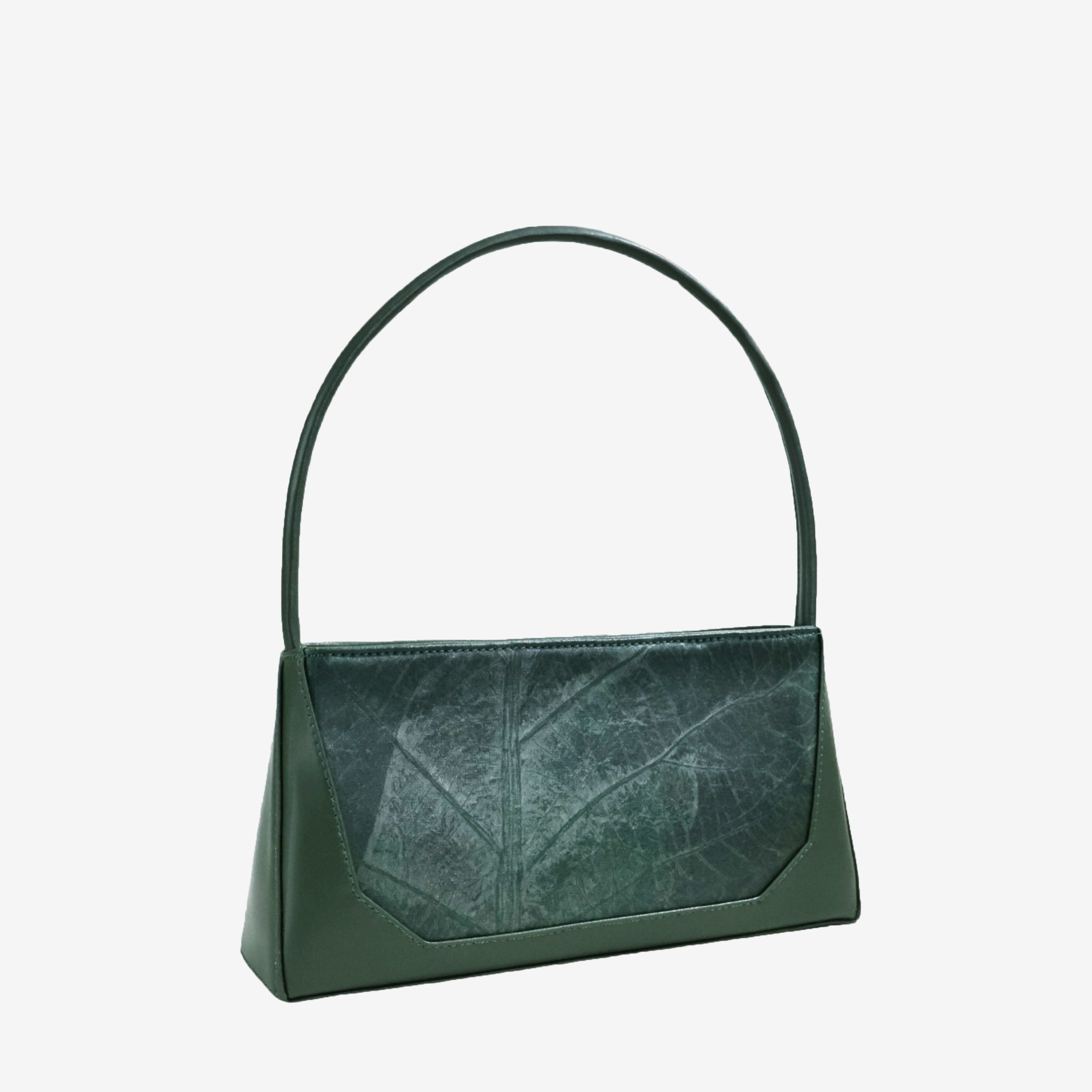 Three-quarter angle of IVES bag in forest green leaf leather showcasing its elegant structure