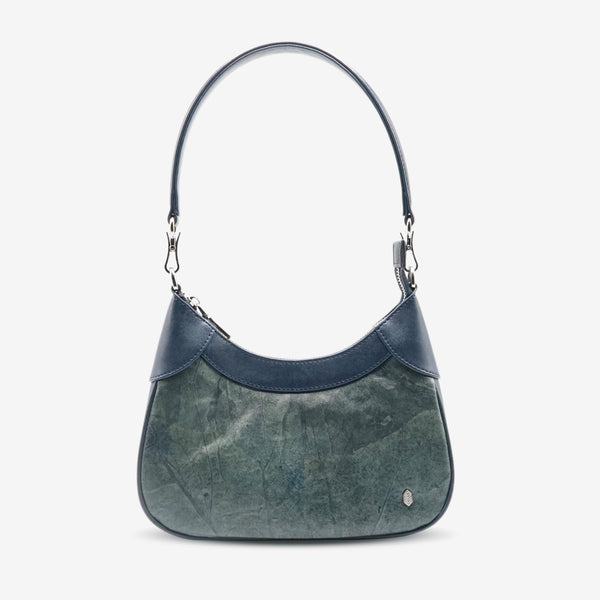 Front view of Kara Vegan Shoulder Bag in Blue Dianne by Thamon showcasing its unique leaf pattern and sleek design.