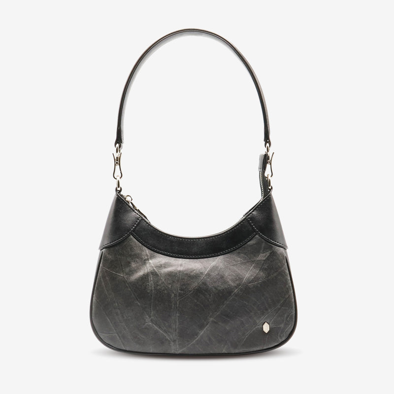 Front view of Kara Vegan Shoulder Bag in Black by Thamon showcasing its sleek design, unique leaf pattern and and detachable shoulder strap.