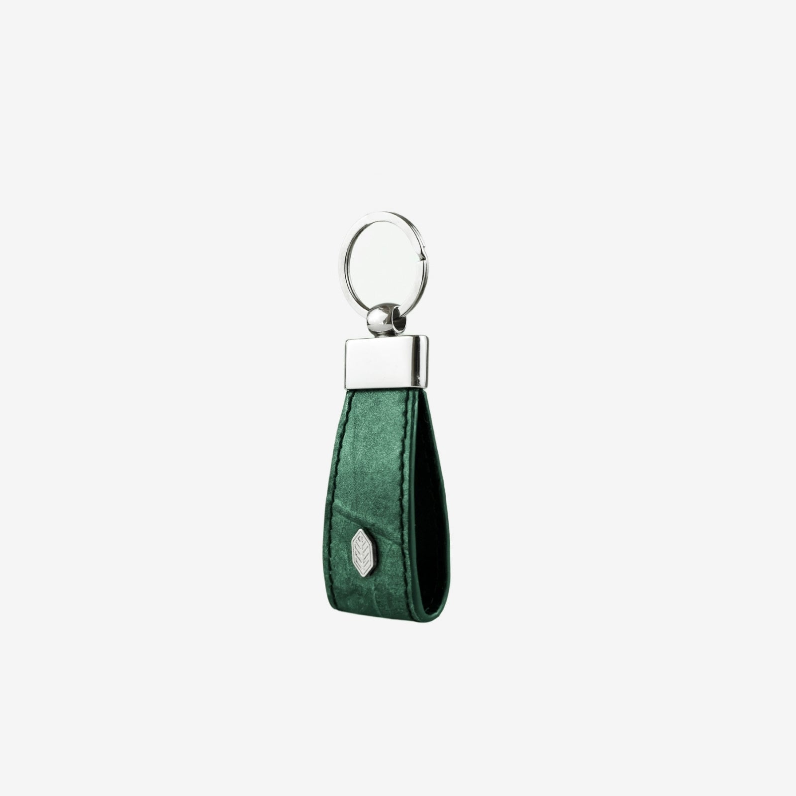 Side profile of keychain in forest green made from leaf leather