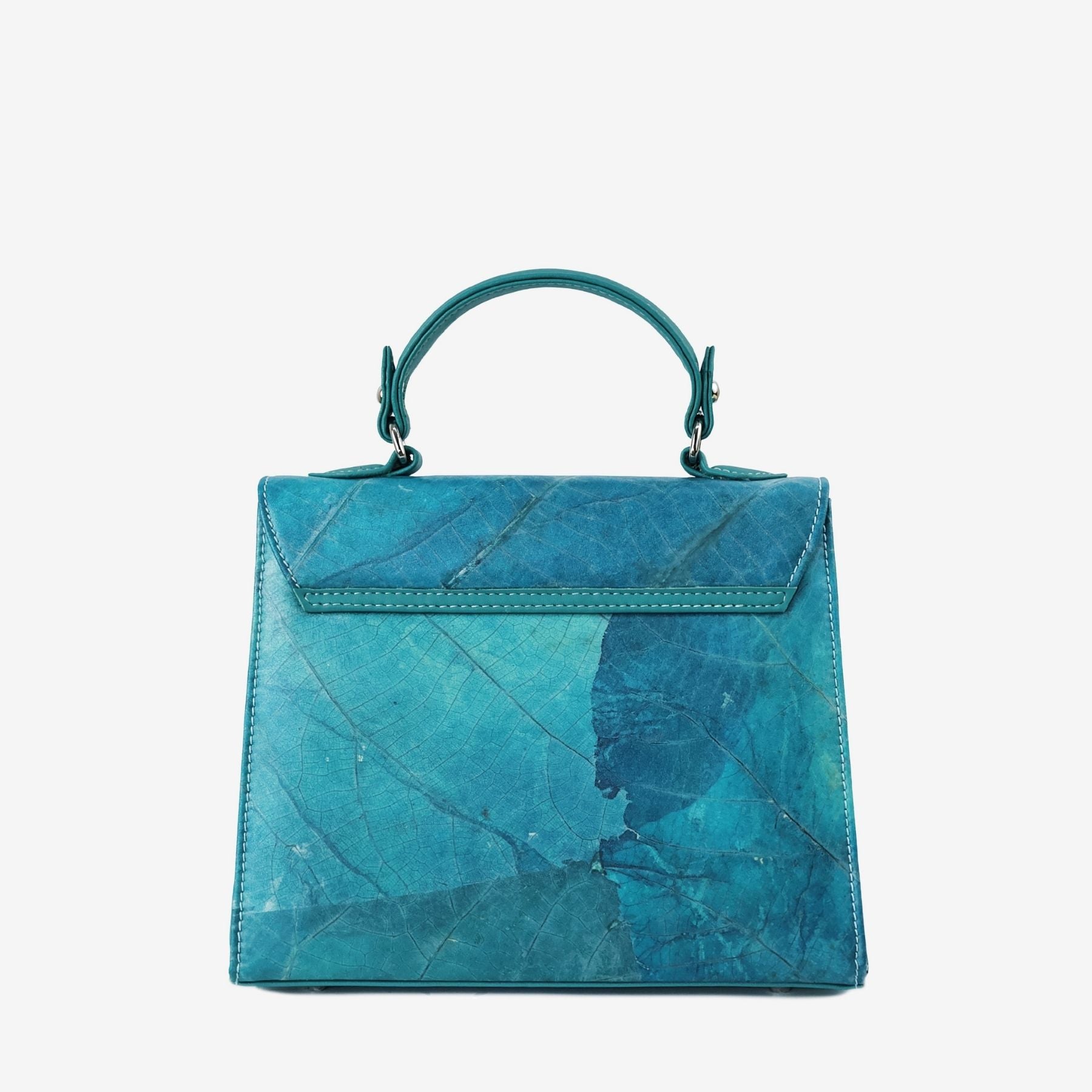 Back view of the Kylie handbag in turquoise Leaftex with natural leaf-vein texture and top handle.