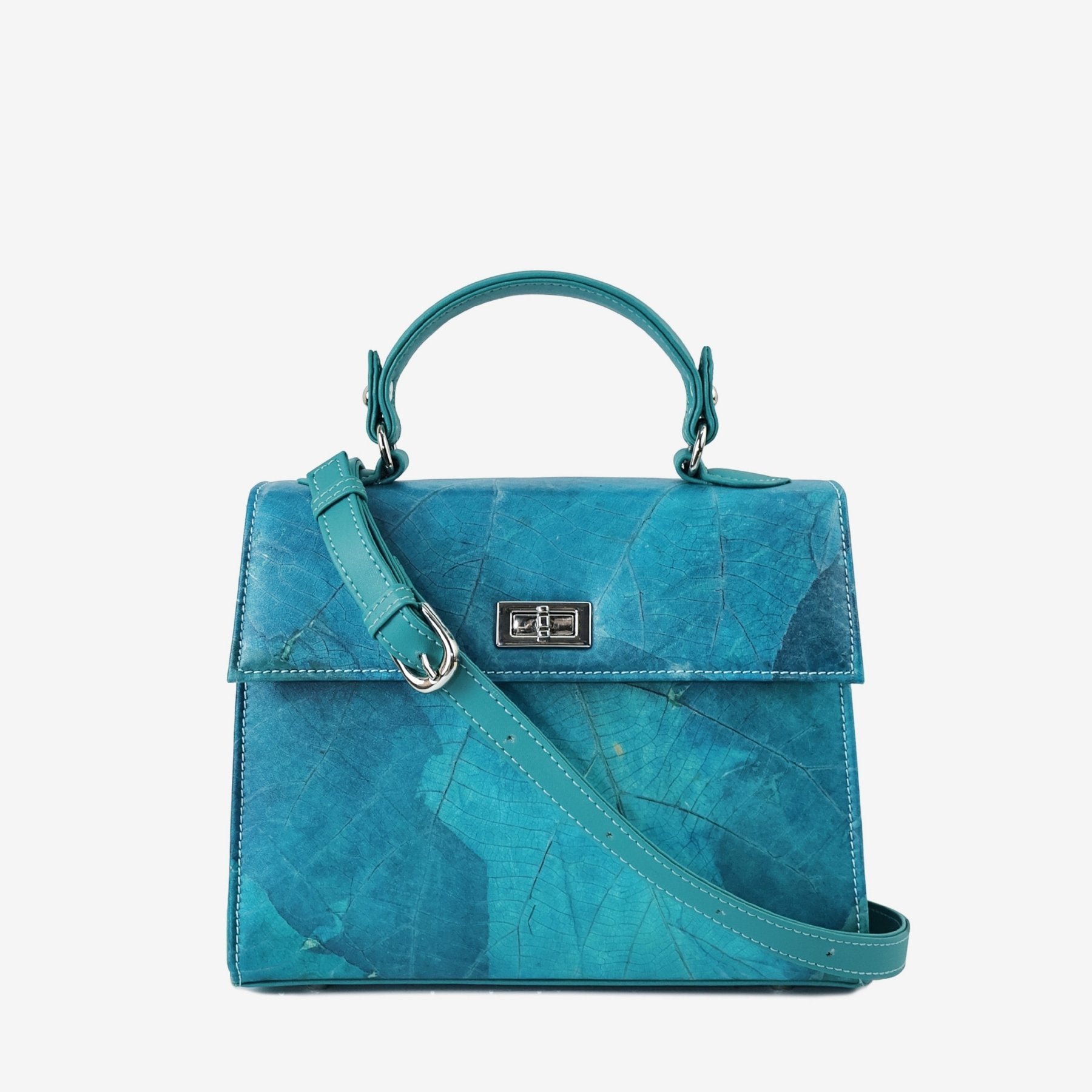 Kylie handbag in turquoise Leaftex shown with its detachable adjustable shoulder strap and silver-tone hardware.