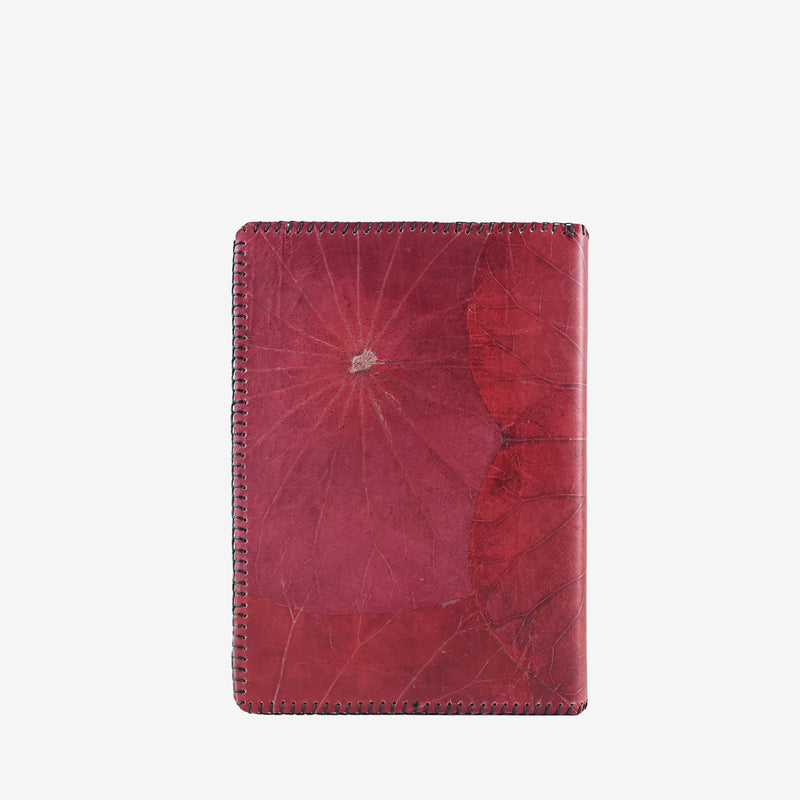 back view of the Lotus A5 refillable notebook in berry red, made from sustainable lotus leaf leather with intricate natural vein patterns and detailed edge stitching.