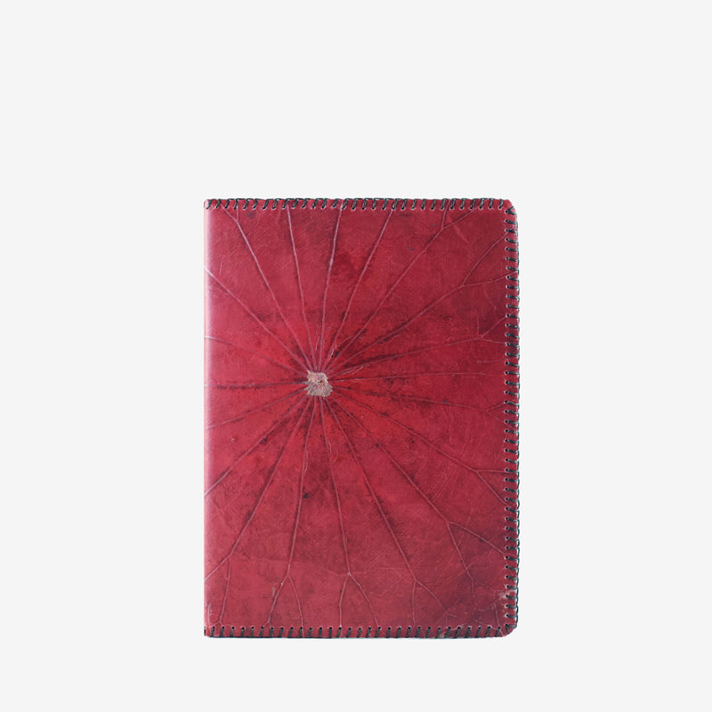 Front view of the Lotus A5 refillable notebook in berry red, made from sustainable lotus leaf leather with intricate natural vein patterns and detailed edge stitching.