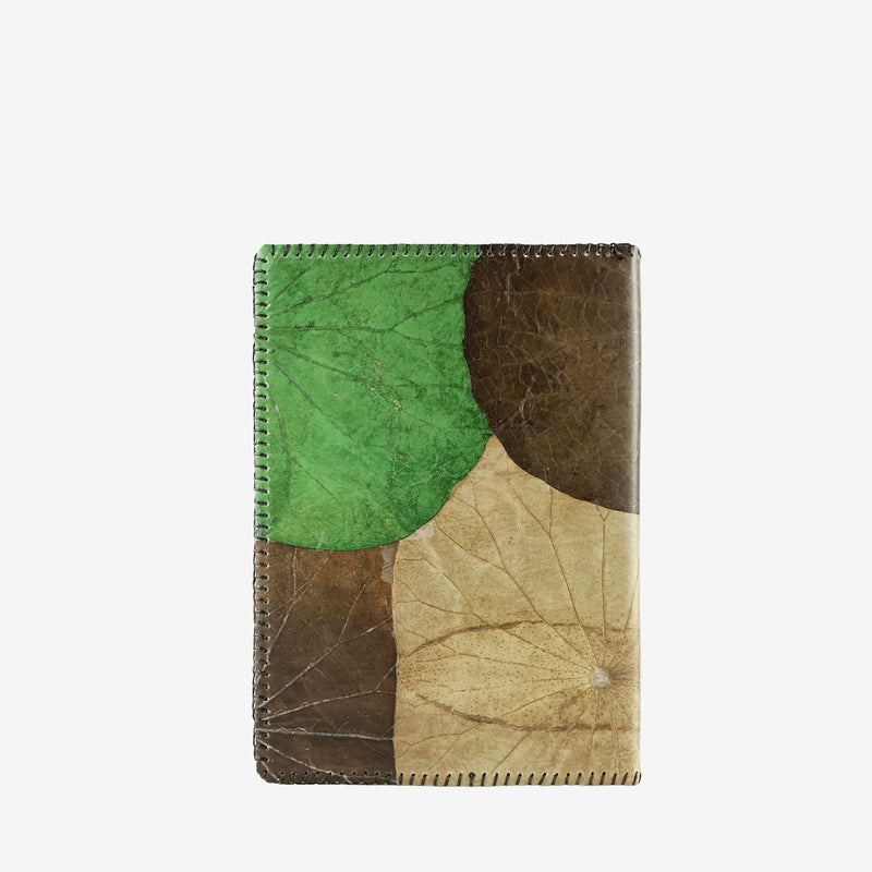 Back view of the Lotus A5 refillable notebook in earthy tones, crafted from sustainable lotus leaf leather with overlapping natural leaf patterns and detailed edge stitching.