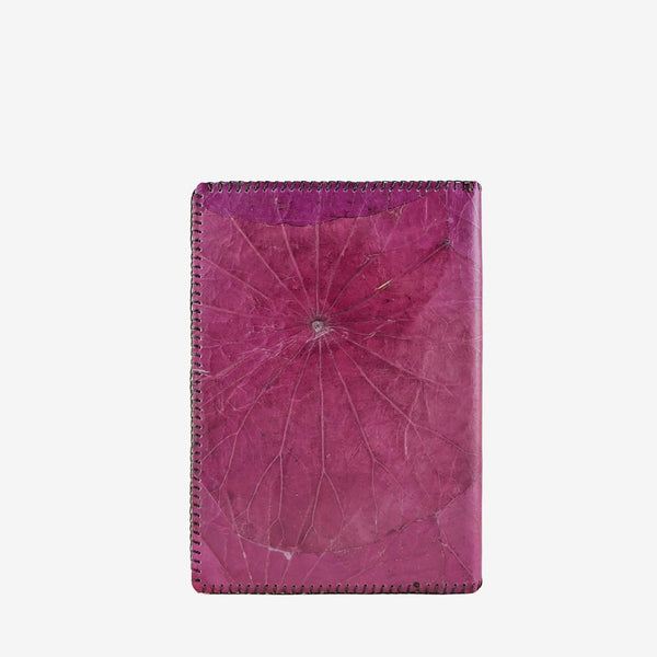 Back view of the Lotus A5 refillable notebook in magenta purple, crafted from sustainable lotus leaf leather with visible natural leaf patterns and detailed stitching along the edges