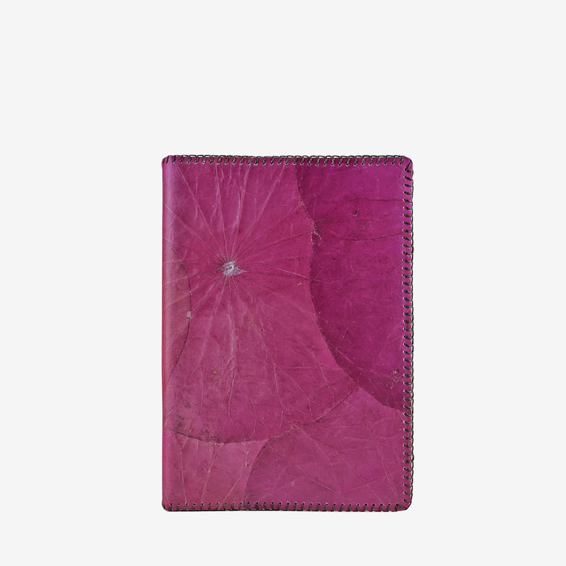 Front view of the Lotus A5 refillable notebook in magenta purple, crafted from sustainable lotus leaf leather with visible natural leaf patterns and detailed stitching along the edges